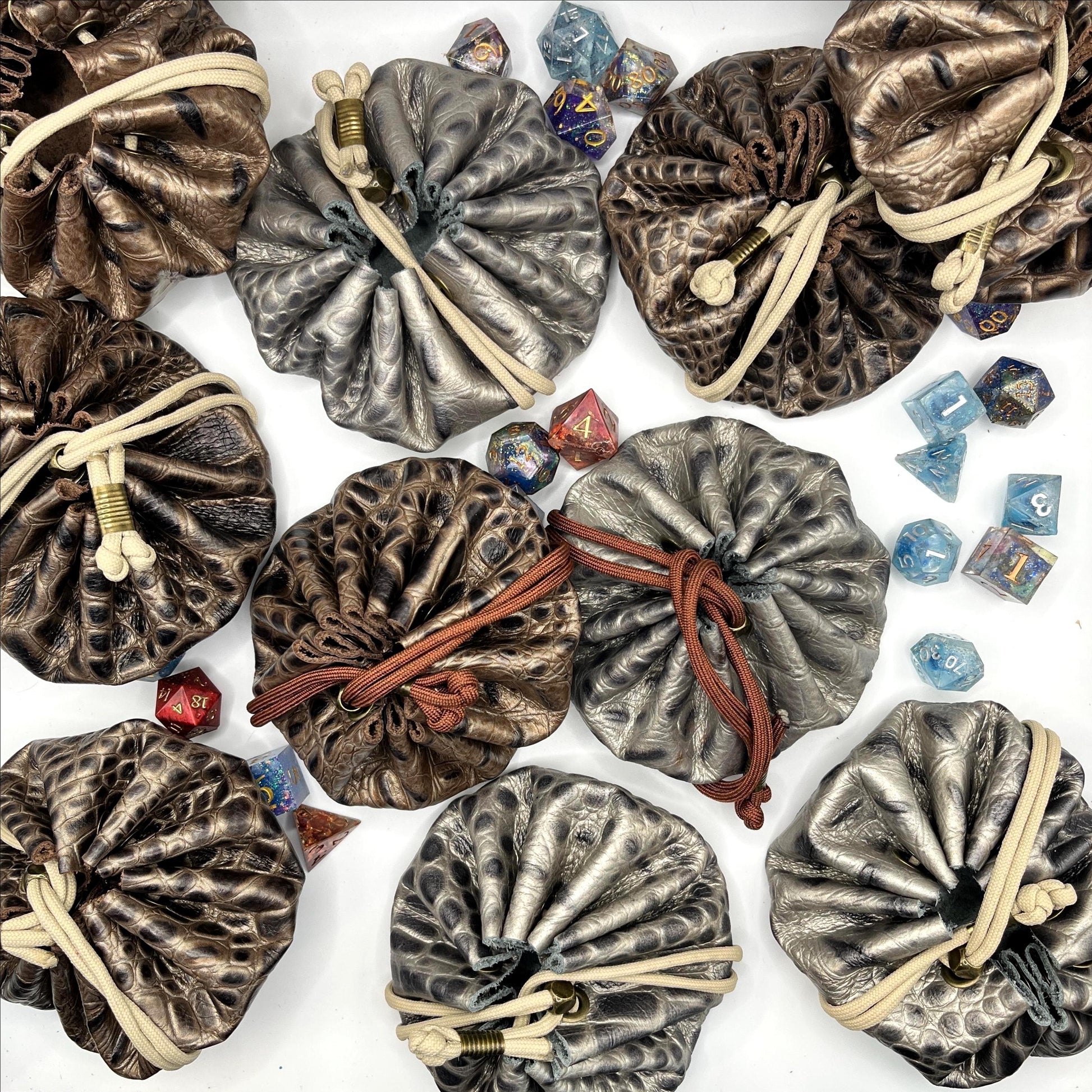 Handcrafted leather dice bag with drawstring, ideal for storing RPG dice sets. Perfect for DnD, tabletop games, or as a fantasy gift for gamers.