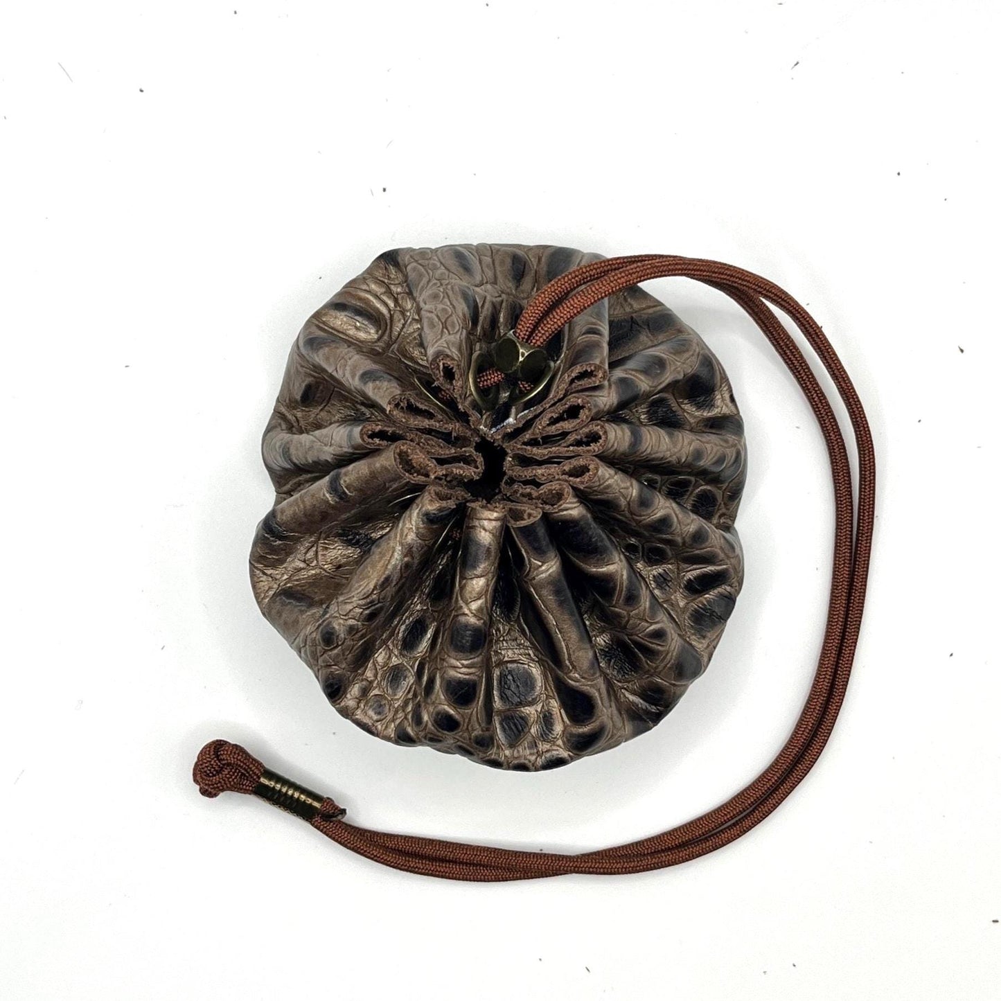 Handcrafted leather dice bag with drawstring, ideal for storing RPG dice sets. Perfect for DnD, tabletop games, or as a fantasy gift for gamers.