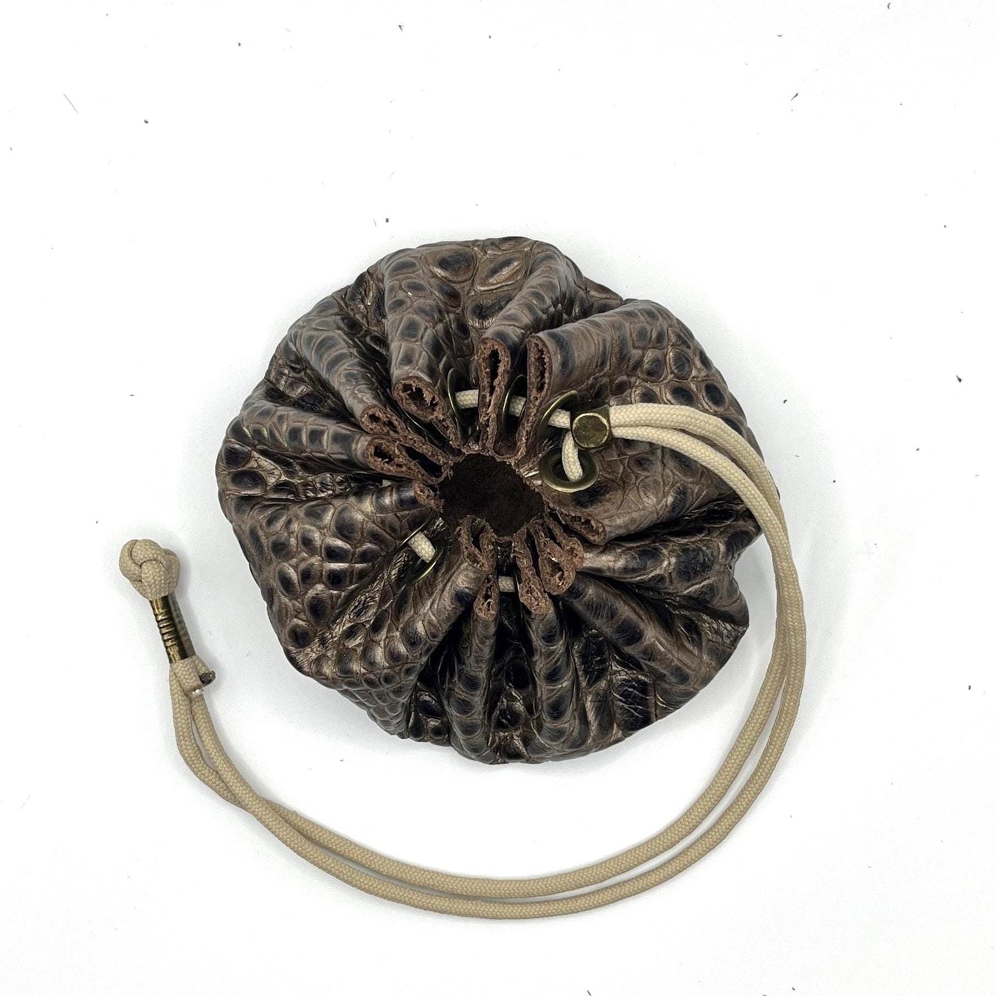 Handcrafted leather dice bag with drawstring, ideal for storing RPG dice sets. Perfect for DnD, tabletop games, or as a fantasy gift for gamers.