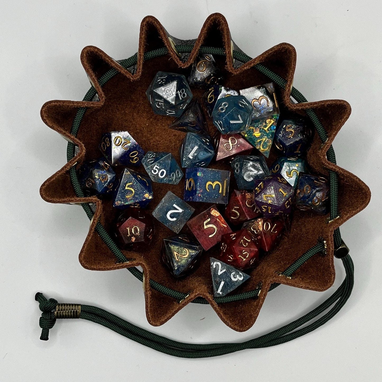 Handcrafted leather dice bag with drawstring, ideal for storing RPG dice sets. Perfect for DnD, tabletop games, or as a fantasy gift for gamers.