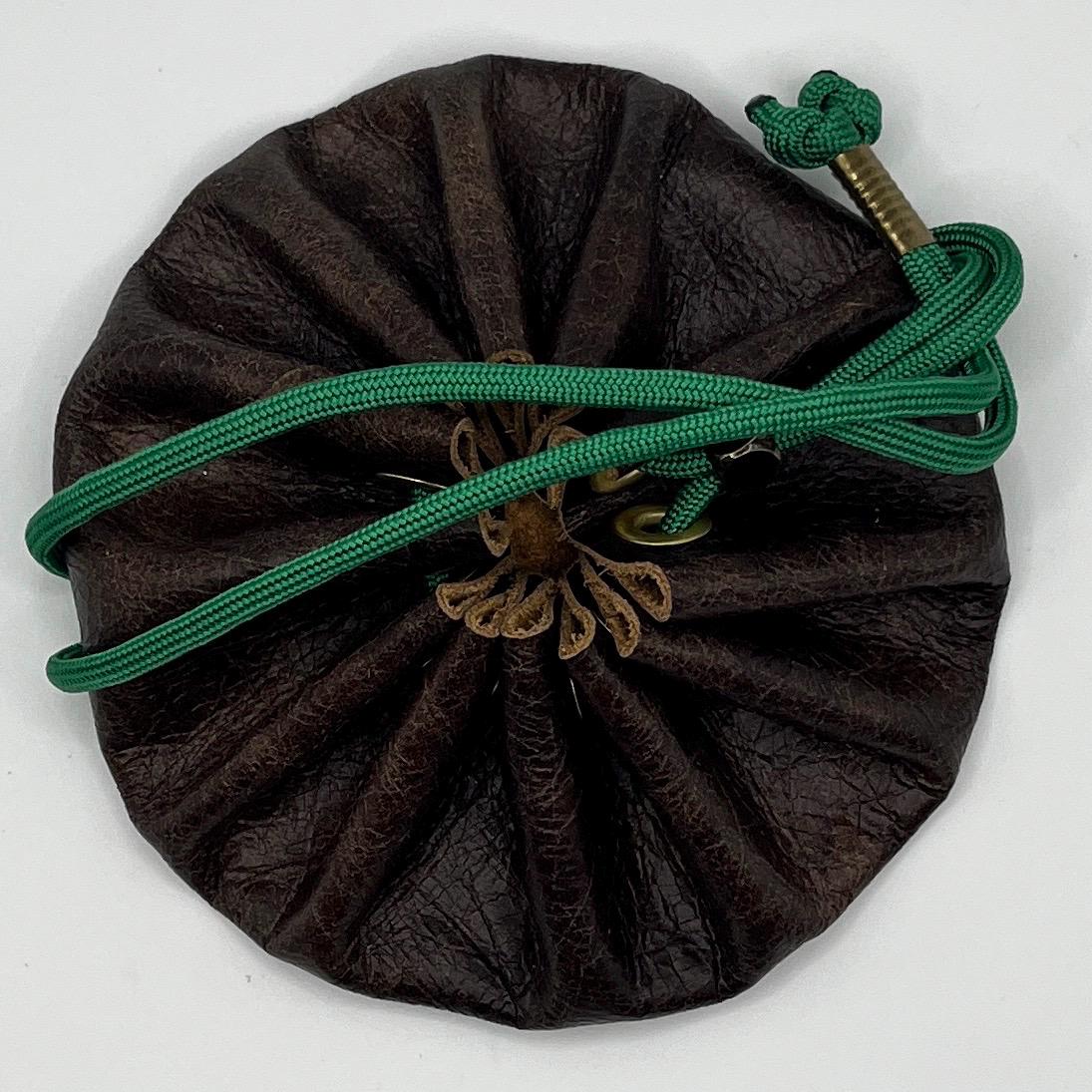 Handcrafted leather dice bag with drawstring, ideal for storing RPG dice sets. Perfect for DnD, tabletop games, or as a fantasy gift for gamers.