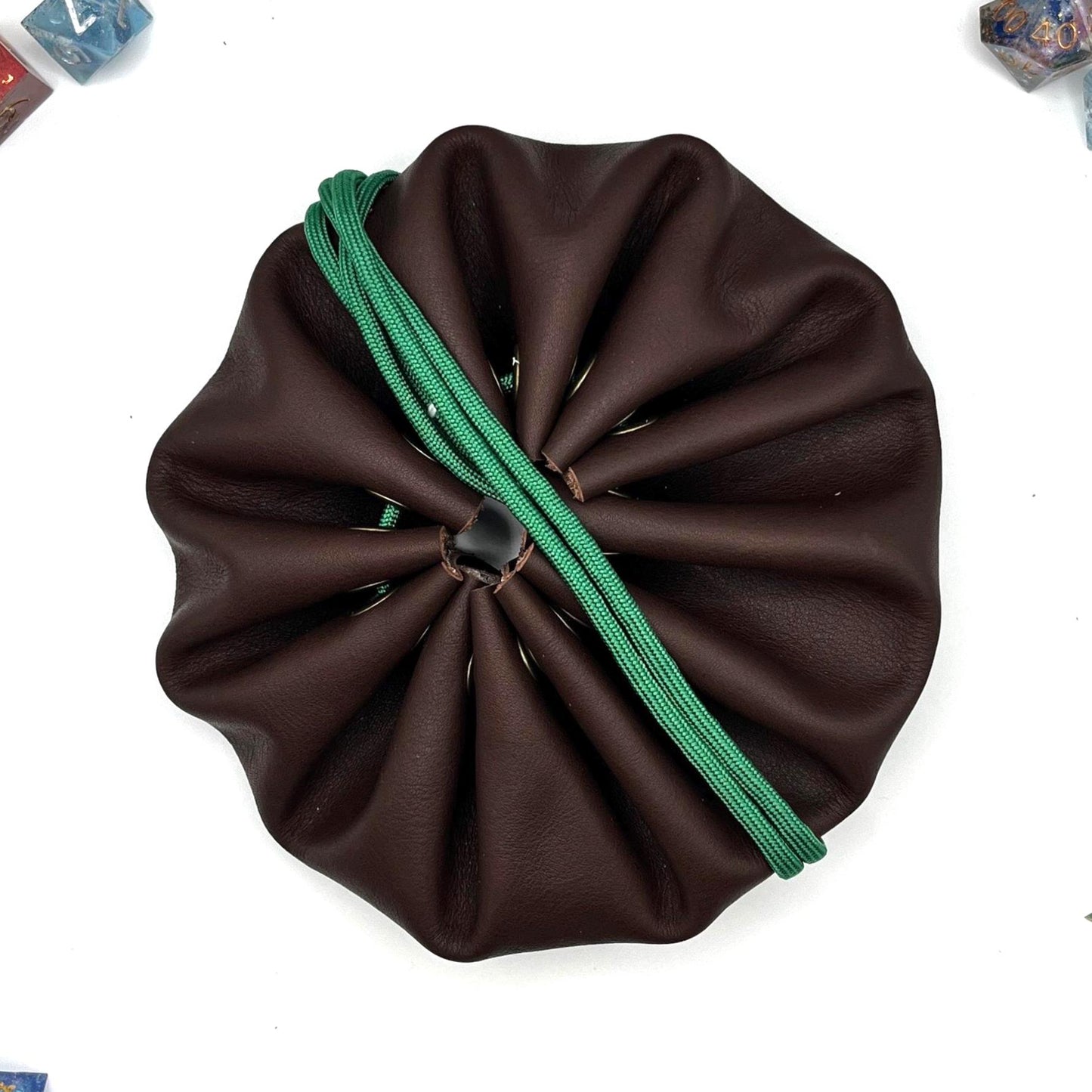 Handcrafted leather dice bag with drawstring, ideal for storing RPG dice sets. Perfect for DnD, tabletop games, or as a fantasy gift for gamers.