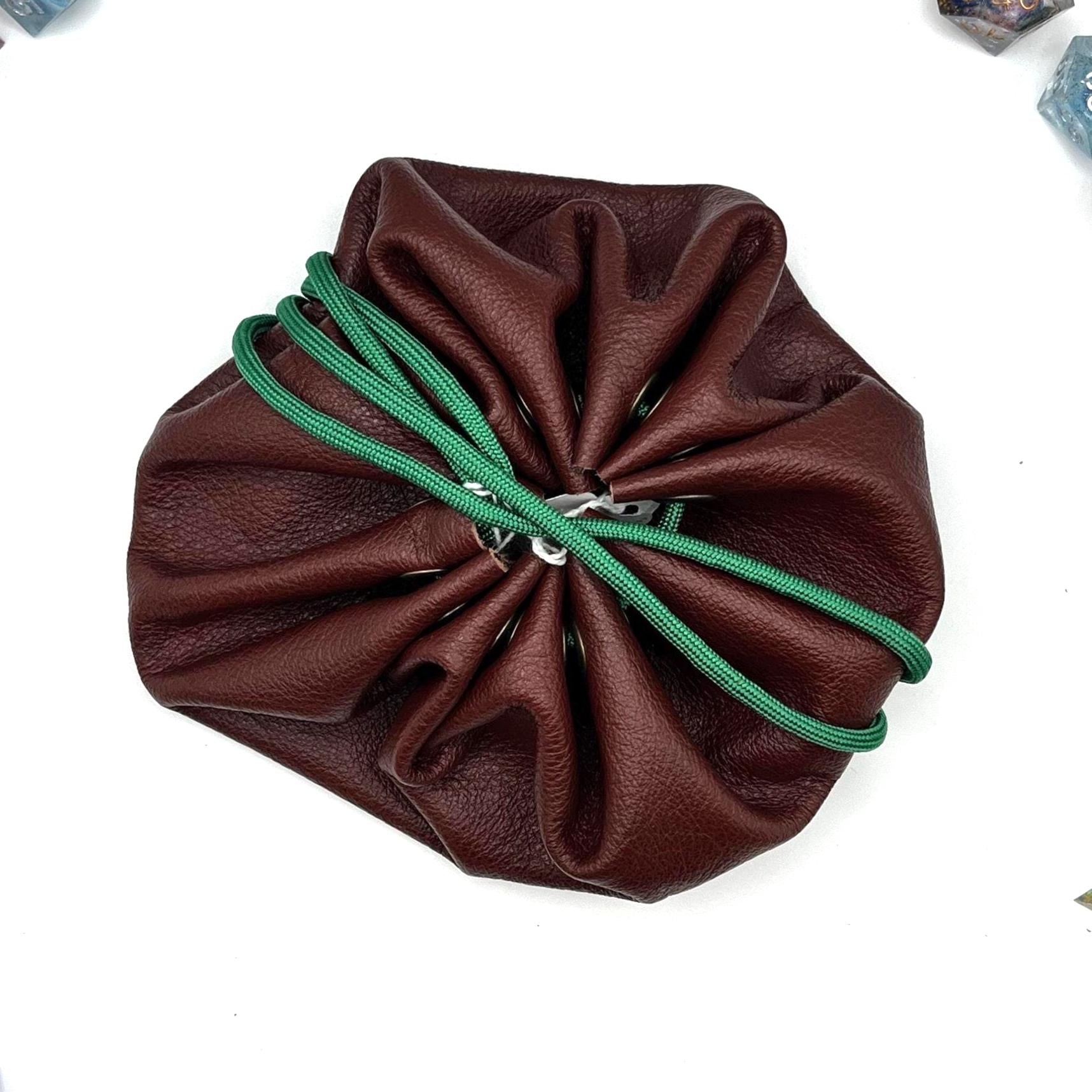 Handcrafted leather dice bag with drawstring, ideal for storing RPG dice sets. Perfect for DnD, tabletop games, or as a fantasy gift for gamers.