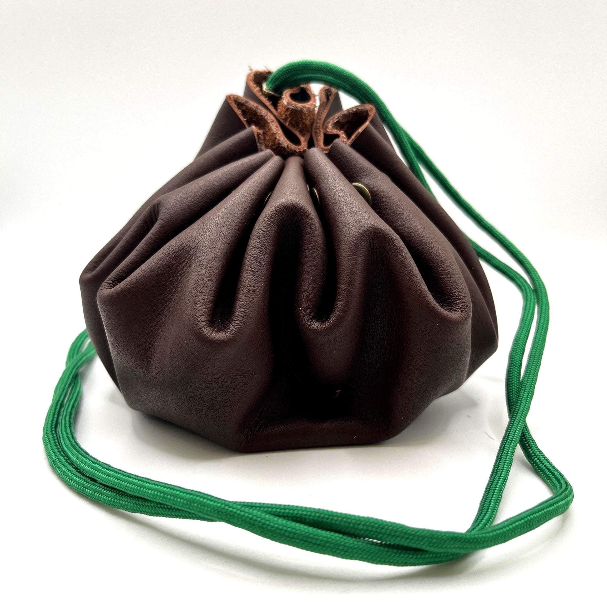 Handcrafted leather dice bag with drawstring, ideal for storing RPG dice sets. Perfect for DnD, tabletop games, or as a fantasy gift for gamers.