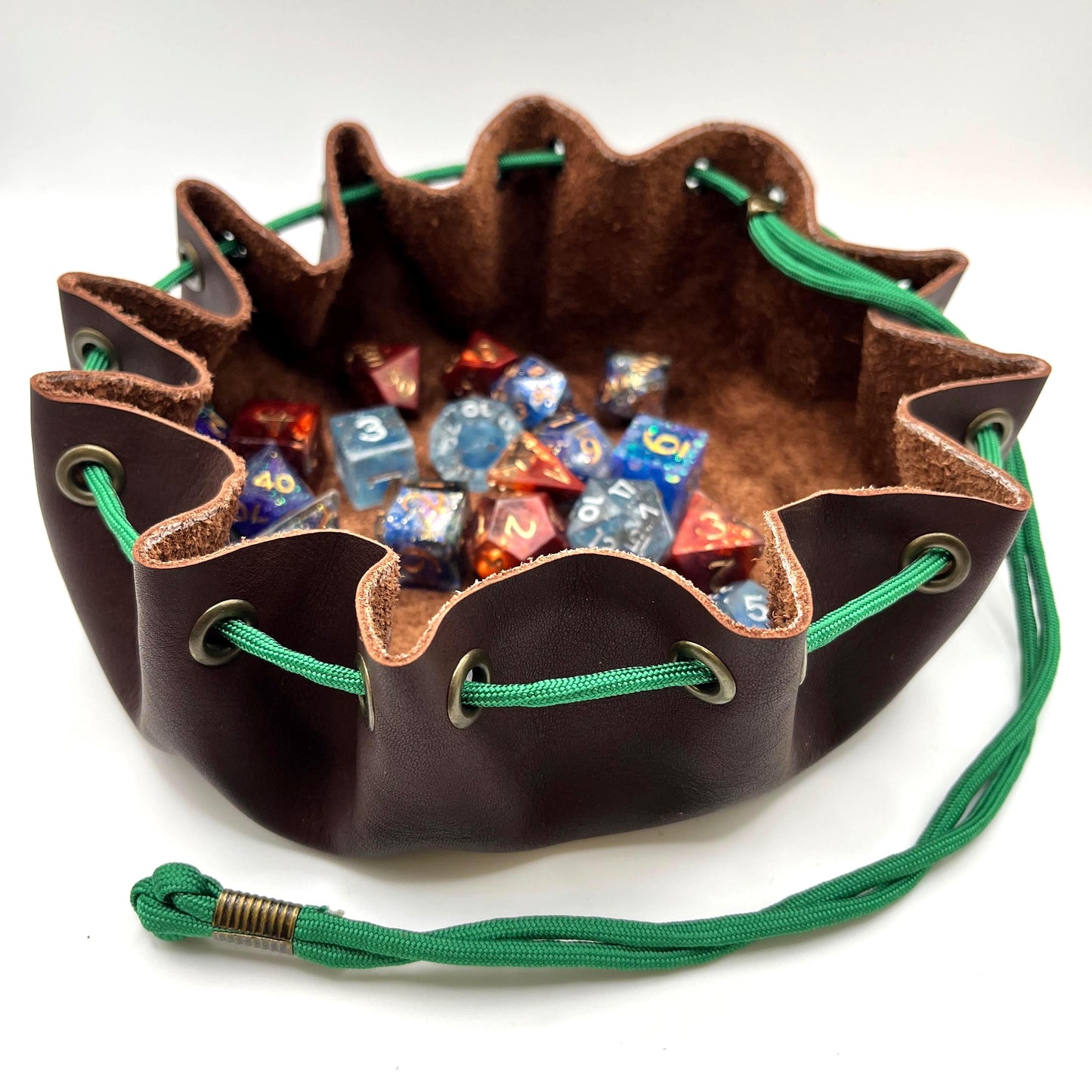 Handcrafted leather dice bag with drawstring, ideal for storing RPG dice sets. Perfect for DnD, tabletop games, or as a fantasy gift for gamers.