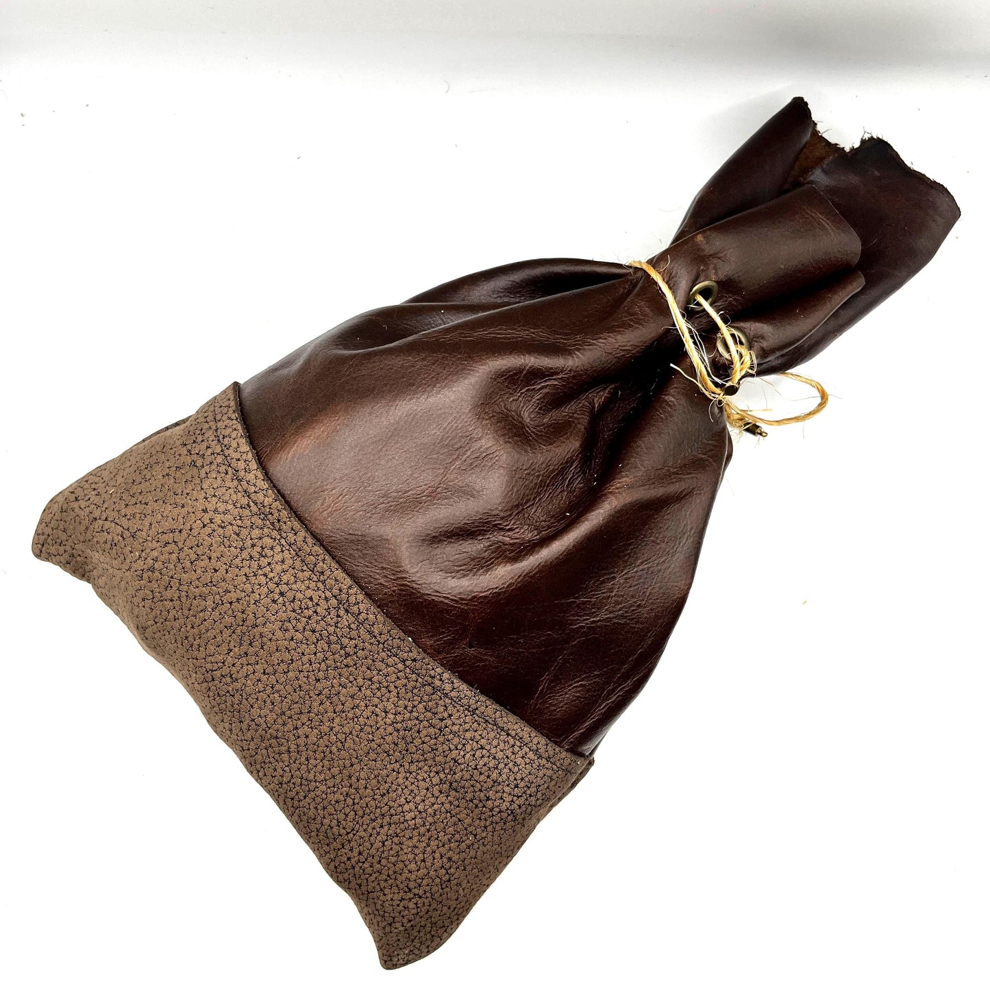 Handcrafted leather dice bag with drawstring, ideal for storing RPG dice sets. Perfect for DnD, tabletop games, or as a fantasy gift for gamers.