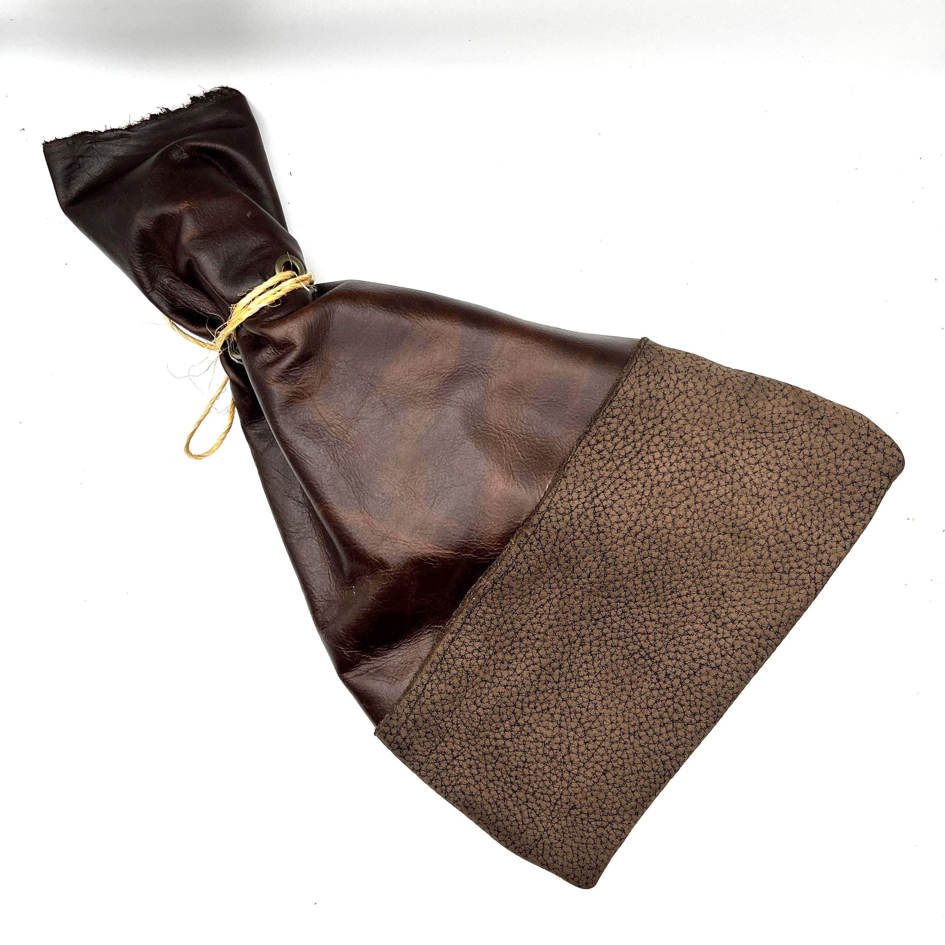 Handcrafted leather dice bag with drawstring, ideal for storing RPG dice sets. Perfect for DnD, tabletop games, or as a fantasy gift for gamers.