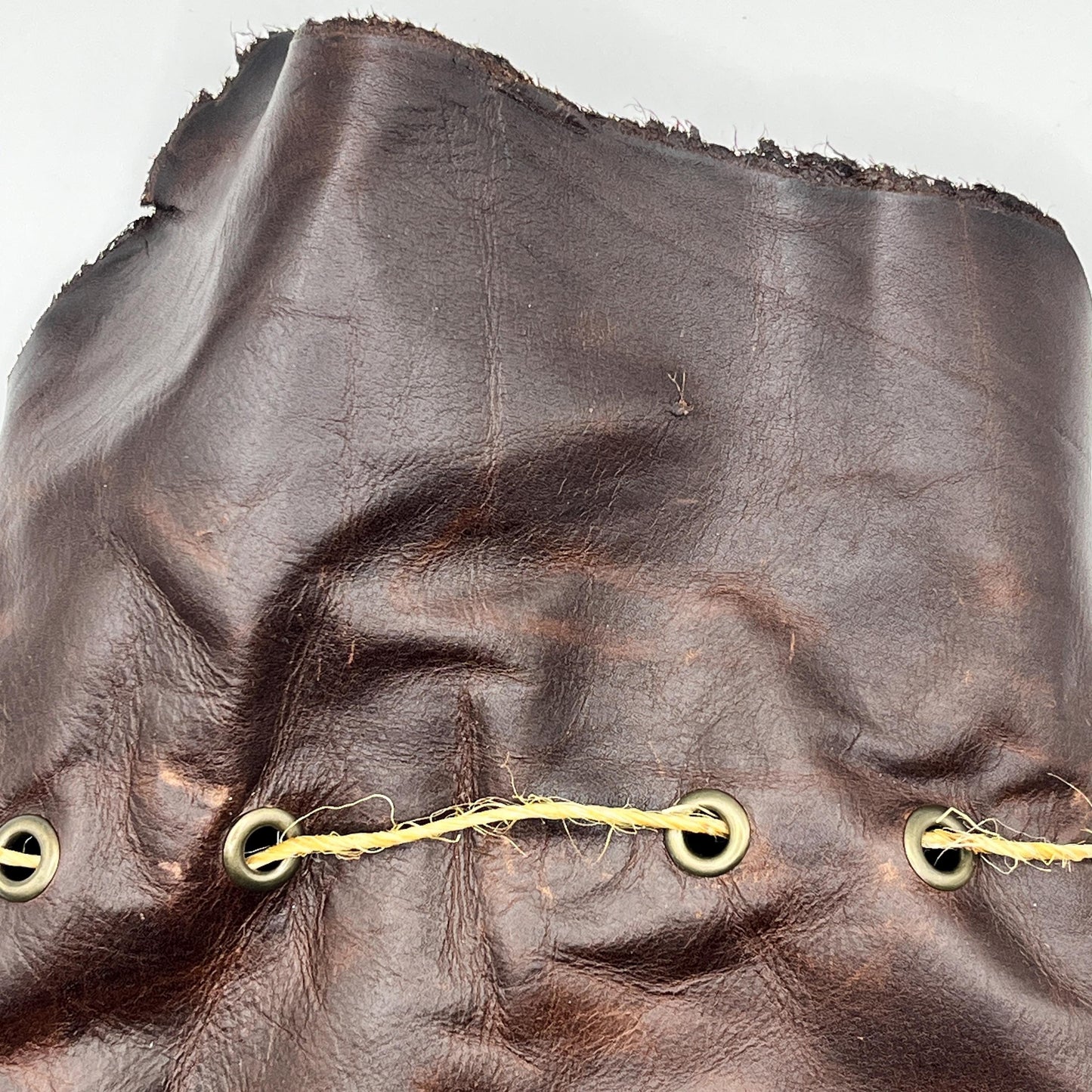 Handcrafted leather dice bag with drawstring, ideal for storing RPG dice sets. Perfect for DnD, tabletop games, or as a fantasy gift for gamers.