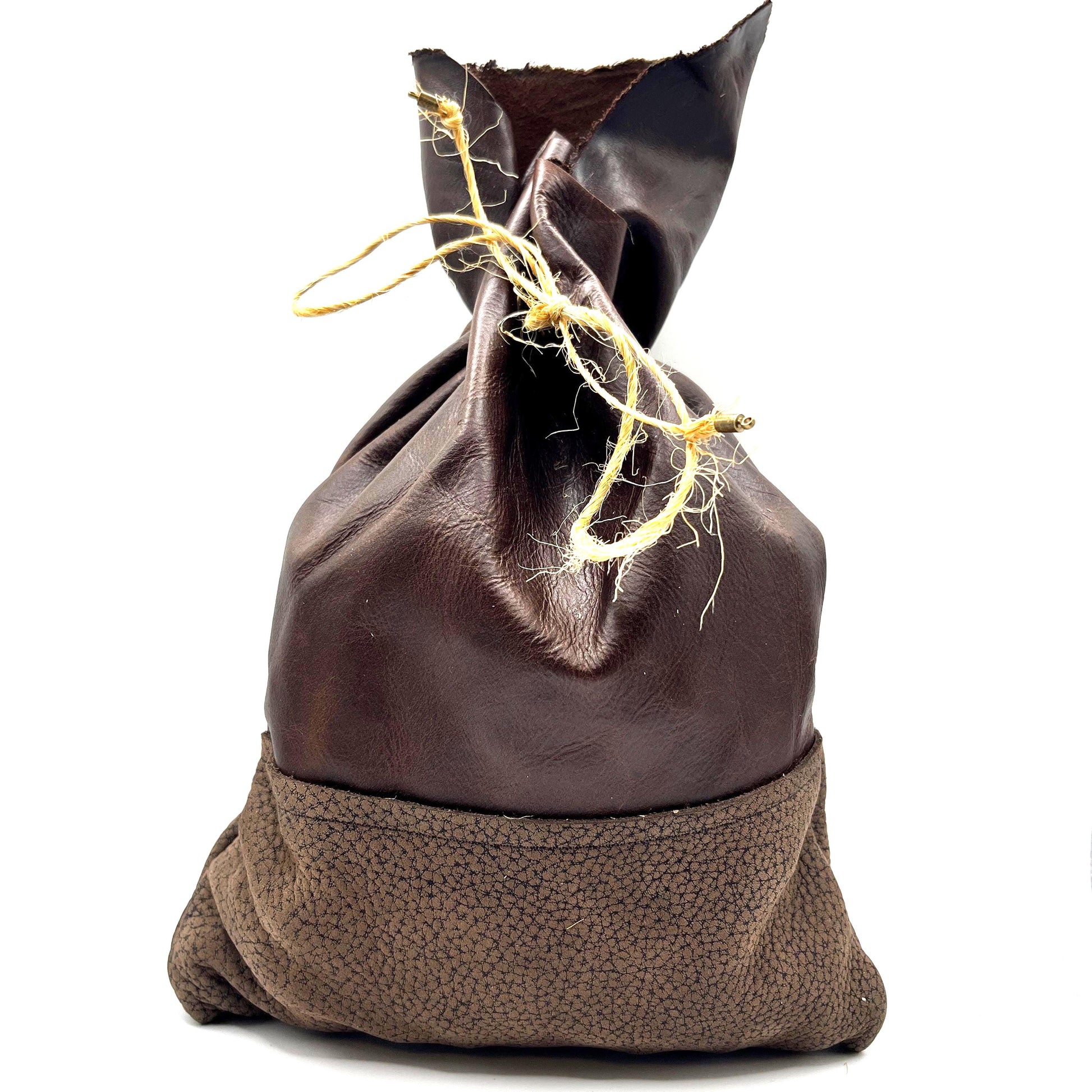 Handcrafted leather dice bag with drawstring, ideal for storing RPG dice sets. Perfect for DnD, tabletop games, or as a fantasy gift for gamers.
