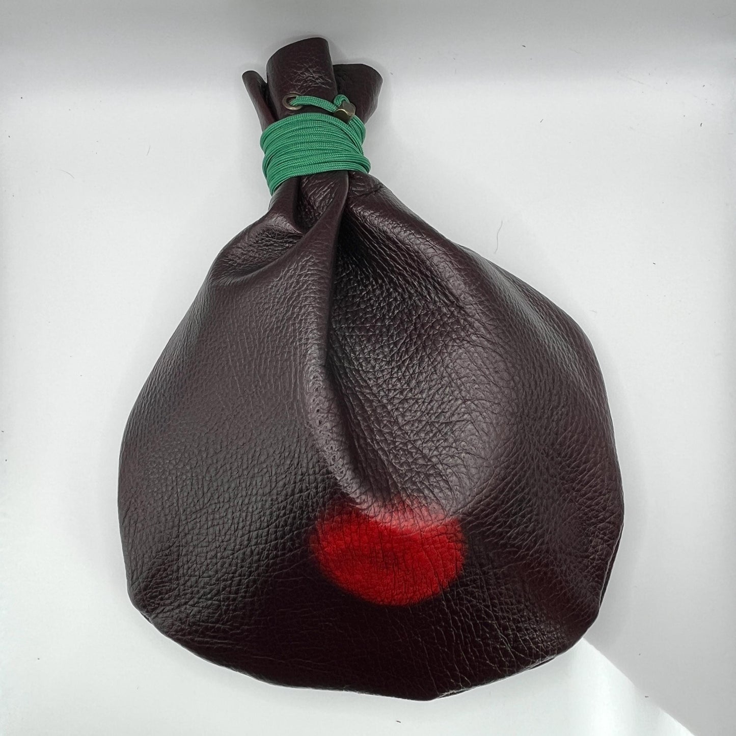 Handcrafted leather dice bag with drawstring, ideal for storing RPG dice sets. Perfect for DnD, tabletop games, or as a fantasy gift for gamers.