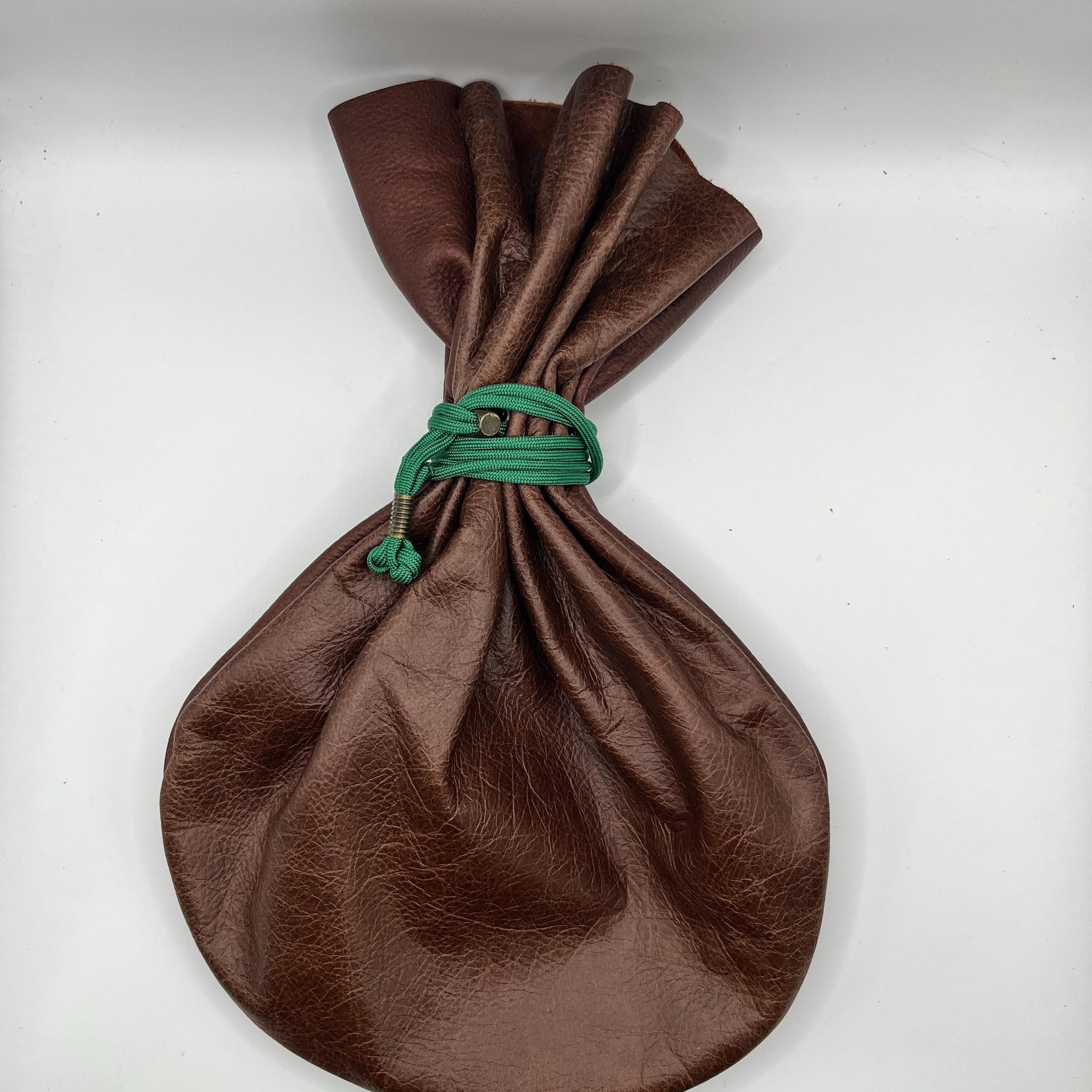 Handcrafted leather dice bag with drawstring, ideal for storing RPG dice sets. Perfect for DnD, tabletop games, or as a fantasy gift for gamers.
