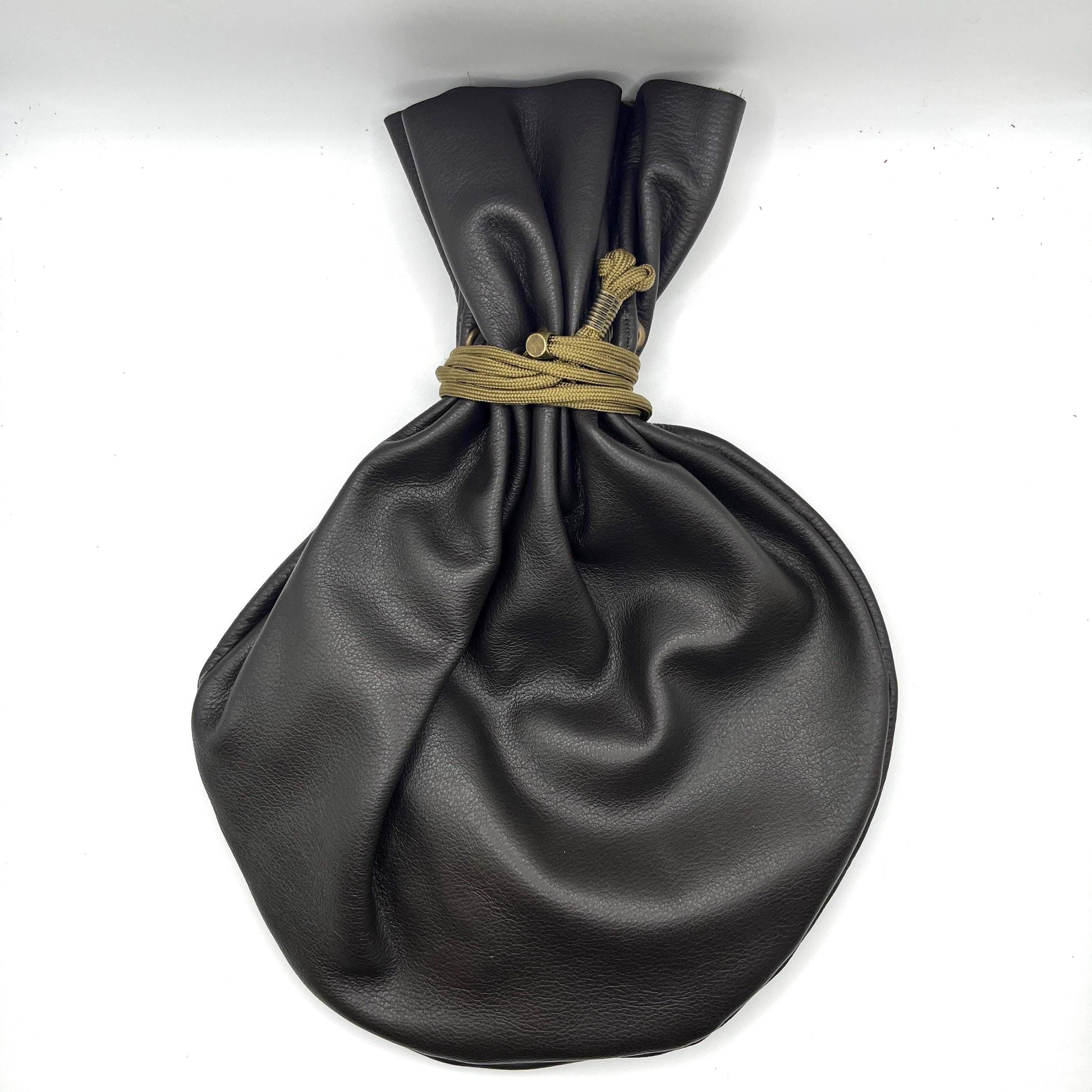 Handcrafted leather dice bag with drawstring, ideal for storing RPG dice sets. Perfect for DnD, tabletop games, or as a fantasy gift for gamers.