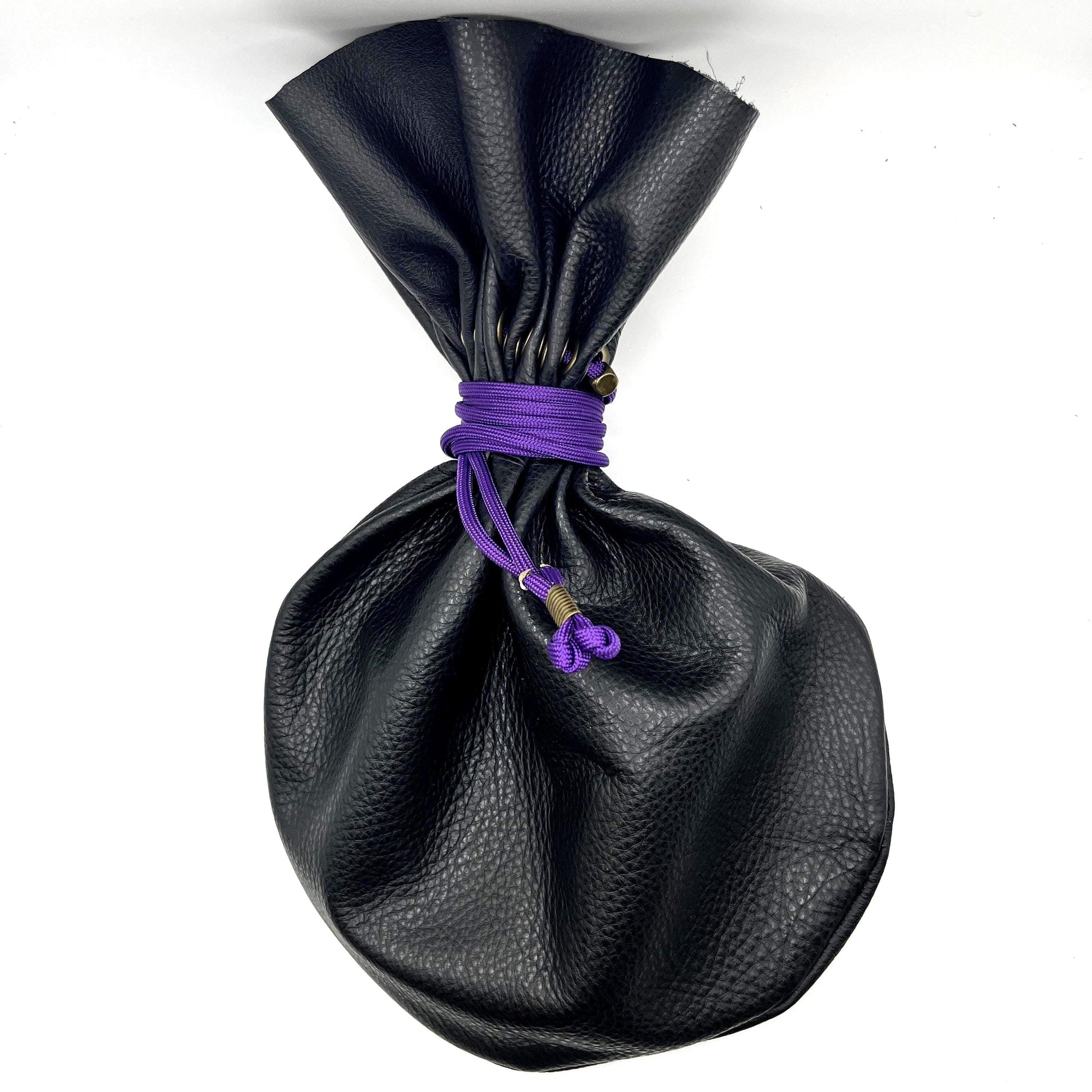 Handcrafted leather dice bag with drawstring, ideal for storing RPG dice sets. Perfect for DnD, tabletop games, or as a fantasy gift for gamers.