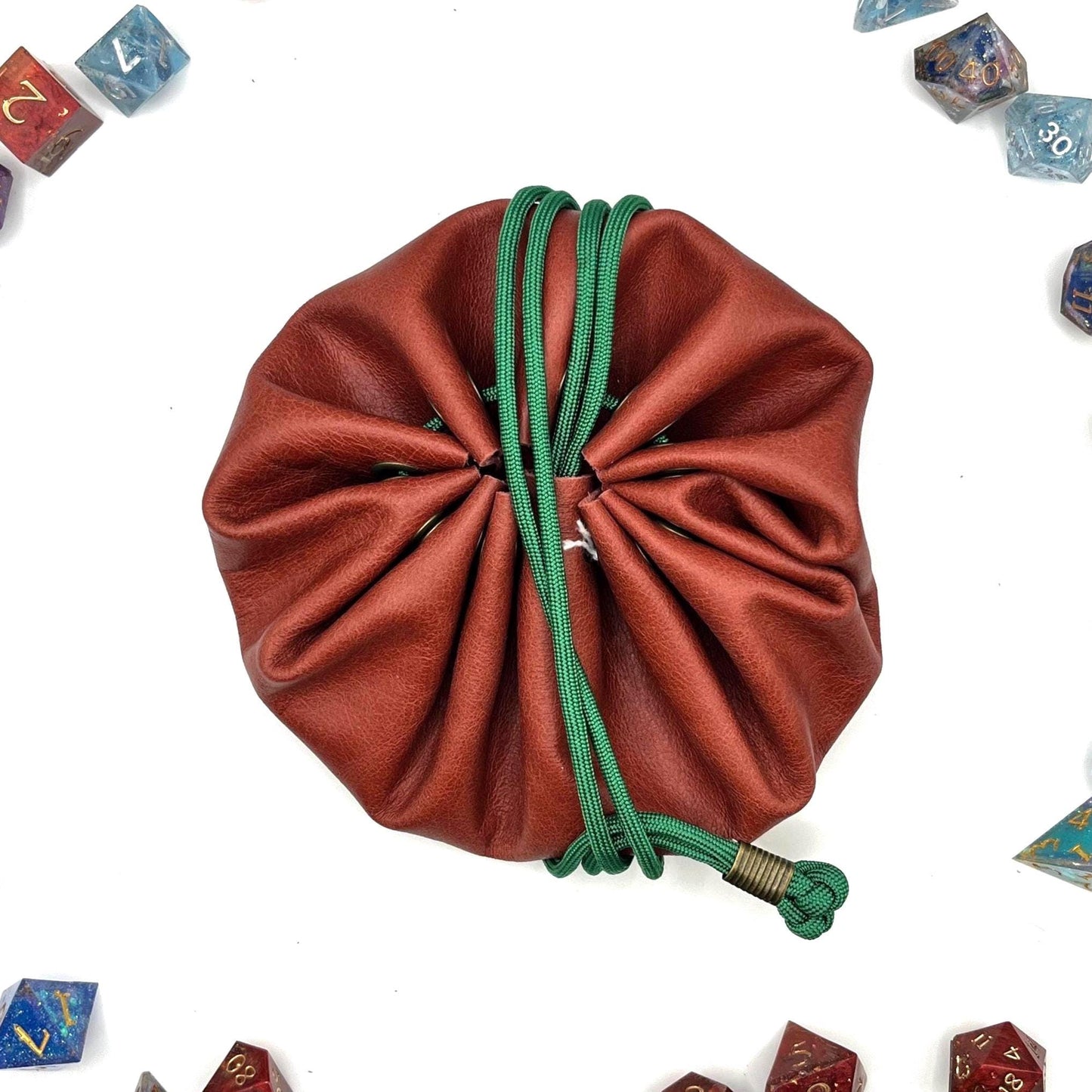 Handcrafted leather dice bag with drawstring, ideal for storing RPG dice sets. Perfect for DnD, tabletop games, or as a fantasy gift for gamers.