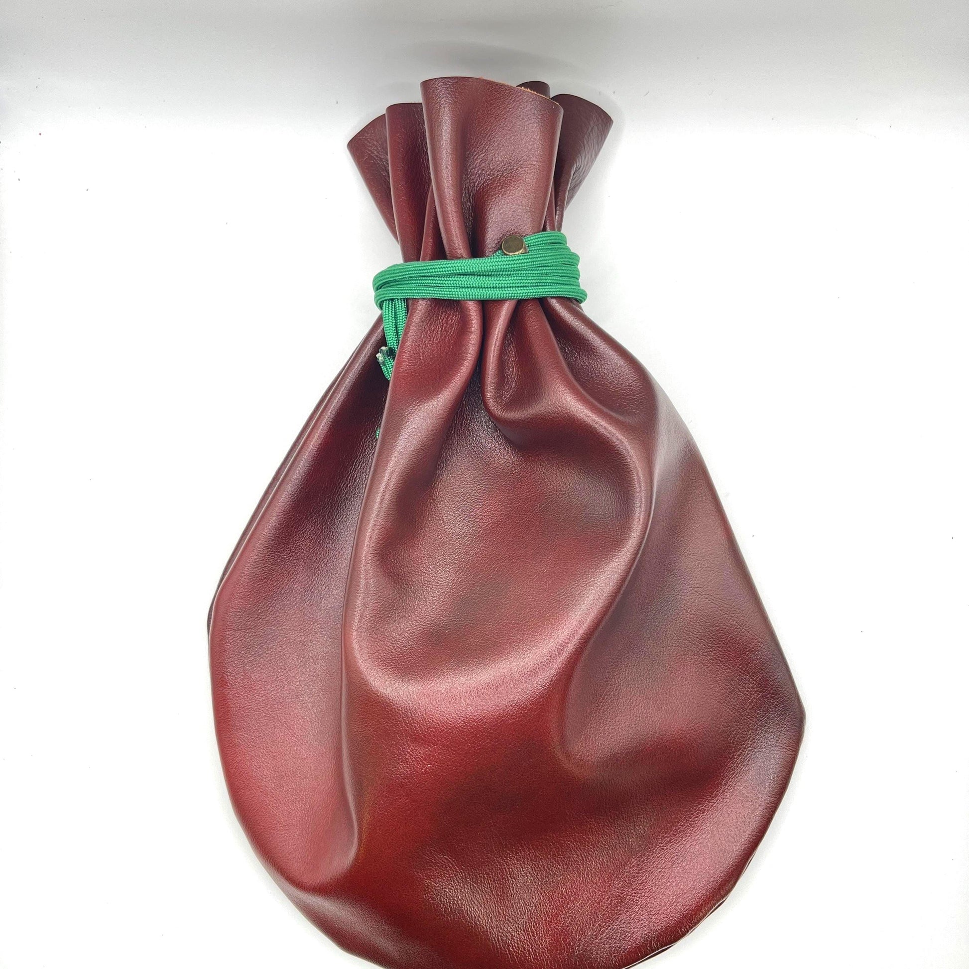 Handcrafted leather dice bag with drawstring, ideal for storing RPG dice sets. Perfect for DnD, tabletop games, or as a fantasy gift for gamers.