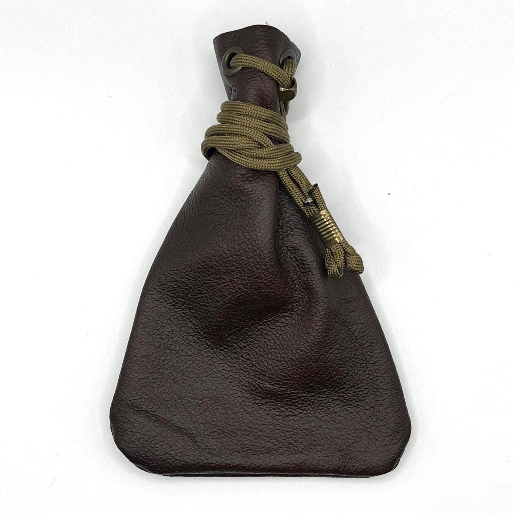 Handcrafted leather dice bag with drawstring, ideal for storing RPG dice sets. Perfect for DnD, tabletop games, or as a fantasy gift for gamers.