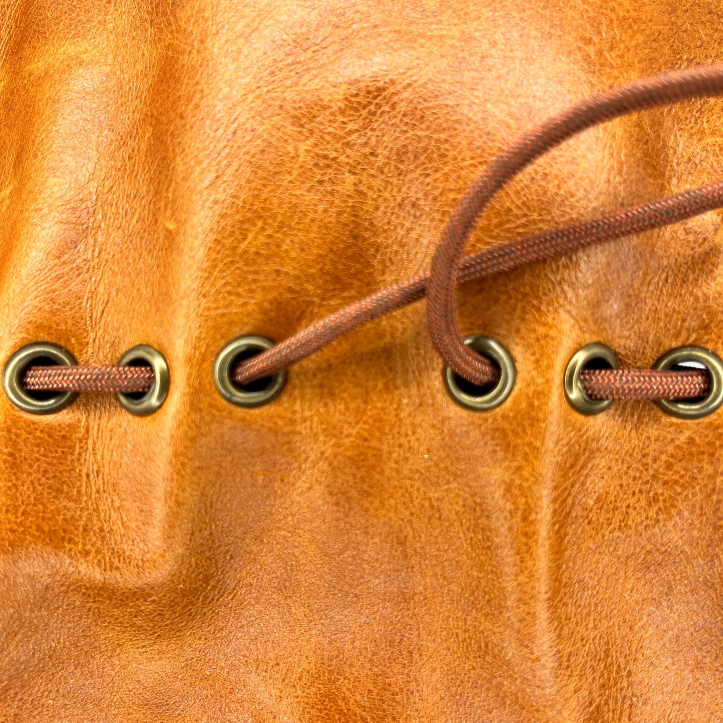 Handcrafted leather dice bag with drawstring, ideal for storing RPG dice sets. Perfect for DnD, tabletop games, or as a fantasy gift for gamers.