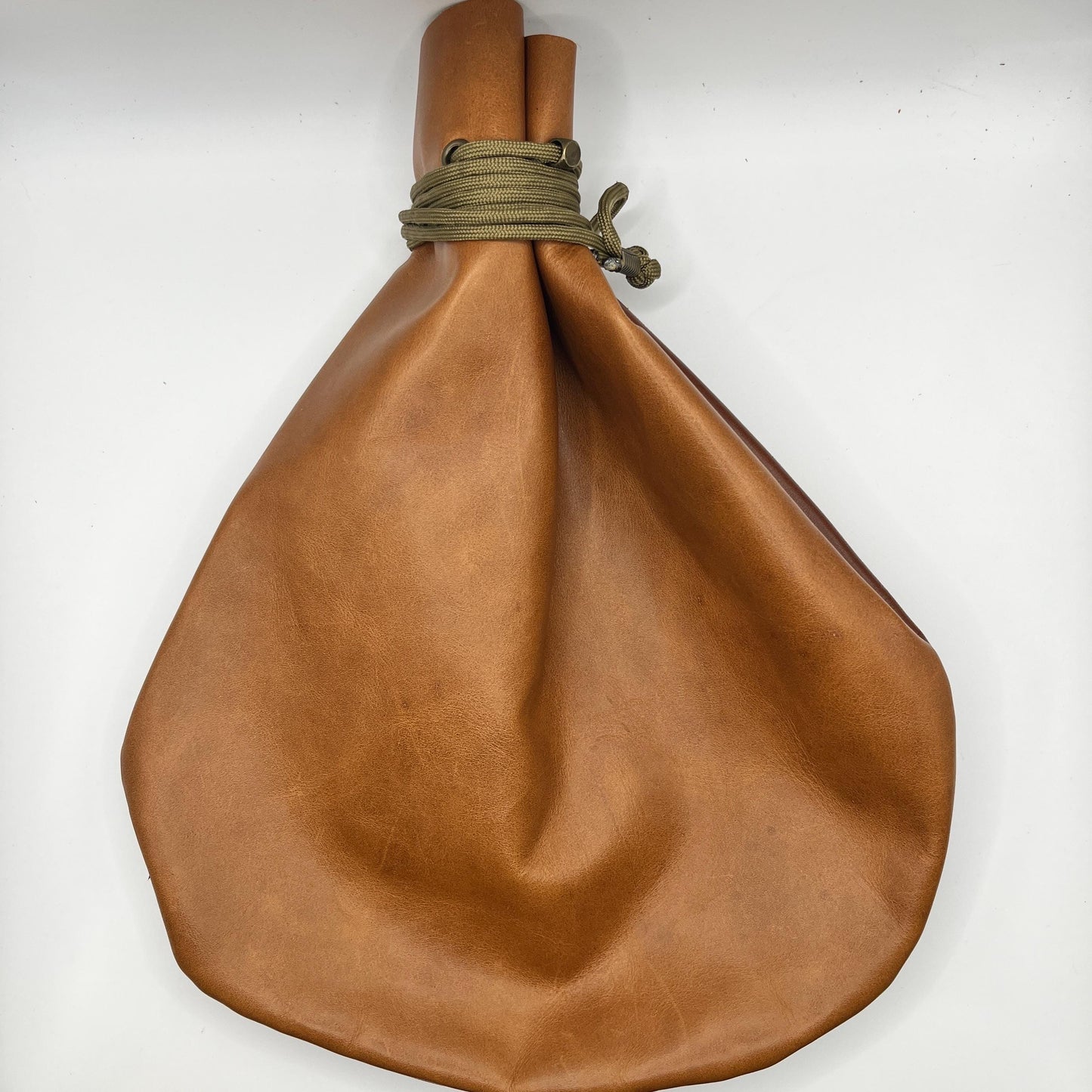 Handcrafted leather dice bag with drawstring, ideal for storing RPG dice sets. Perfect for DnD, tabletop games, or as a fantasy gift for gamers.
