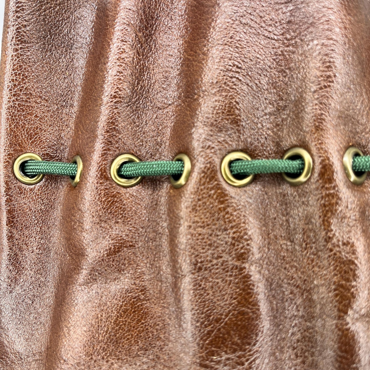 Handcrafted leather dice bag with drawstring, ideal for storing RPG dice sets. Perfect for DnD, tabletop games, or as a fantasy gift for gamers.