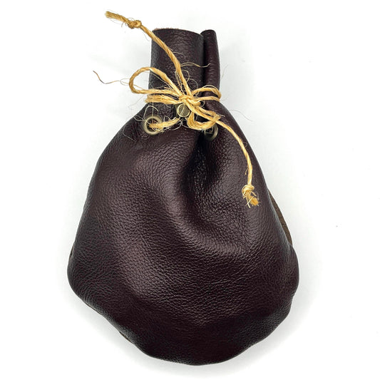 Handcrafted leather dice bag with drawstring, ideal for storing RPG dice sets. Perfect for DnD, tabletop games, or as a fantasy gift for gamers.