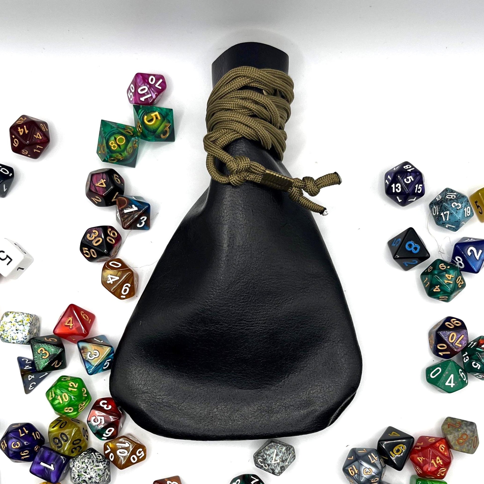Handcrafted leather dice bag with drawstring, ideal for storing RPG dice sets. Perfect for DnD, tabletop games, or as a fantasy gift for gamers.