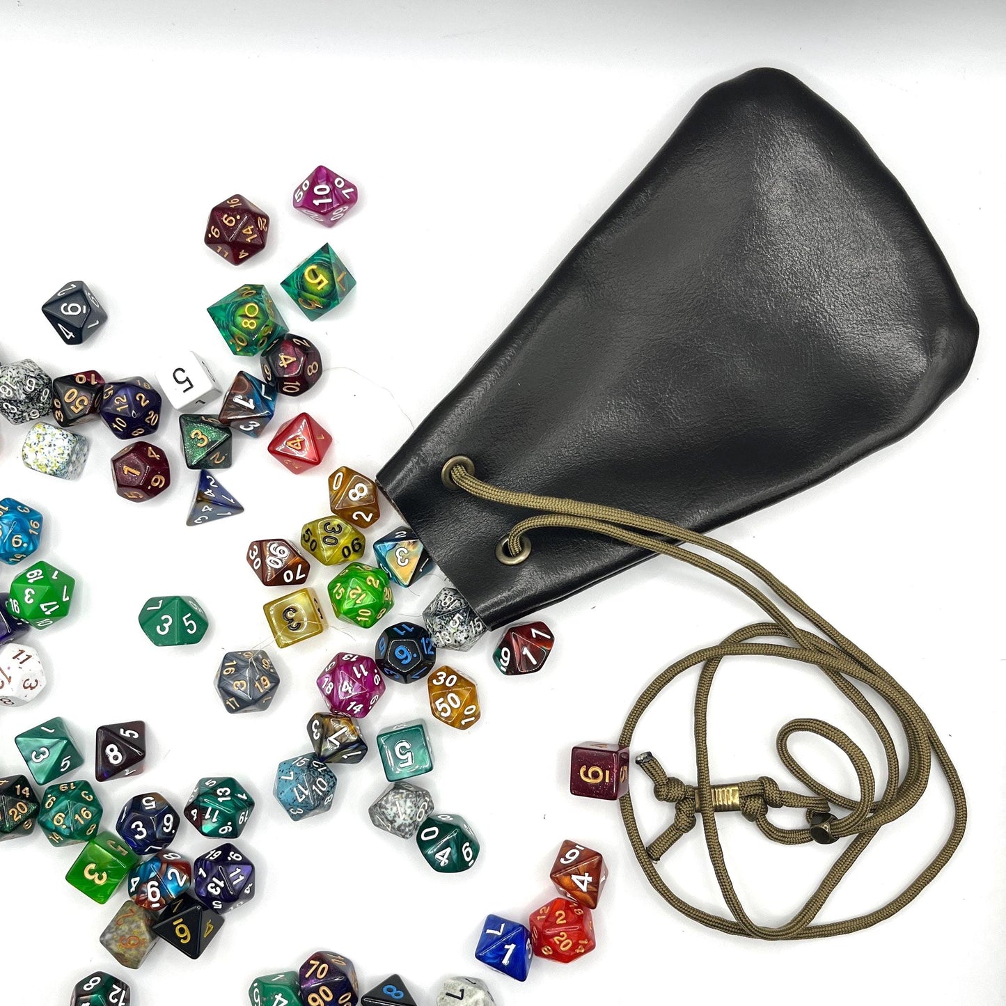 Handcrafted leather dice bag with drawstring, ideal for storing RPG dice sets. Perfect for DnD, tabletop games, or as a fantasy gift for gamers.