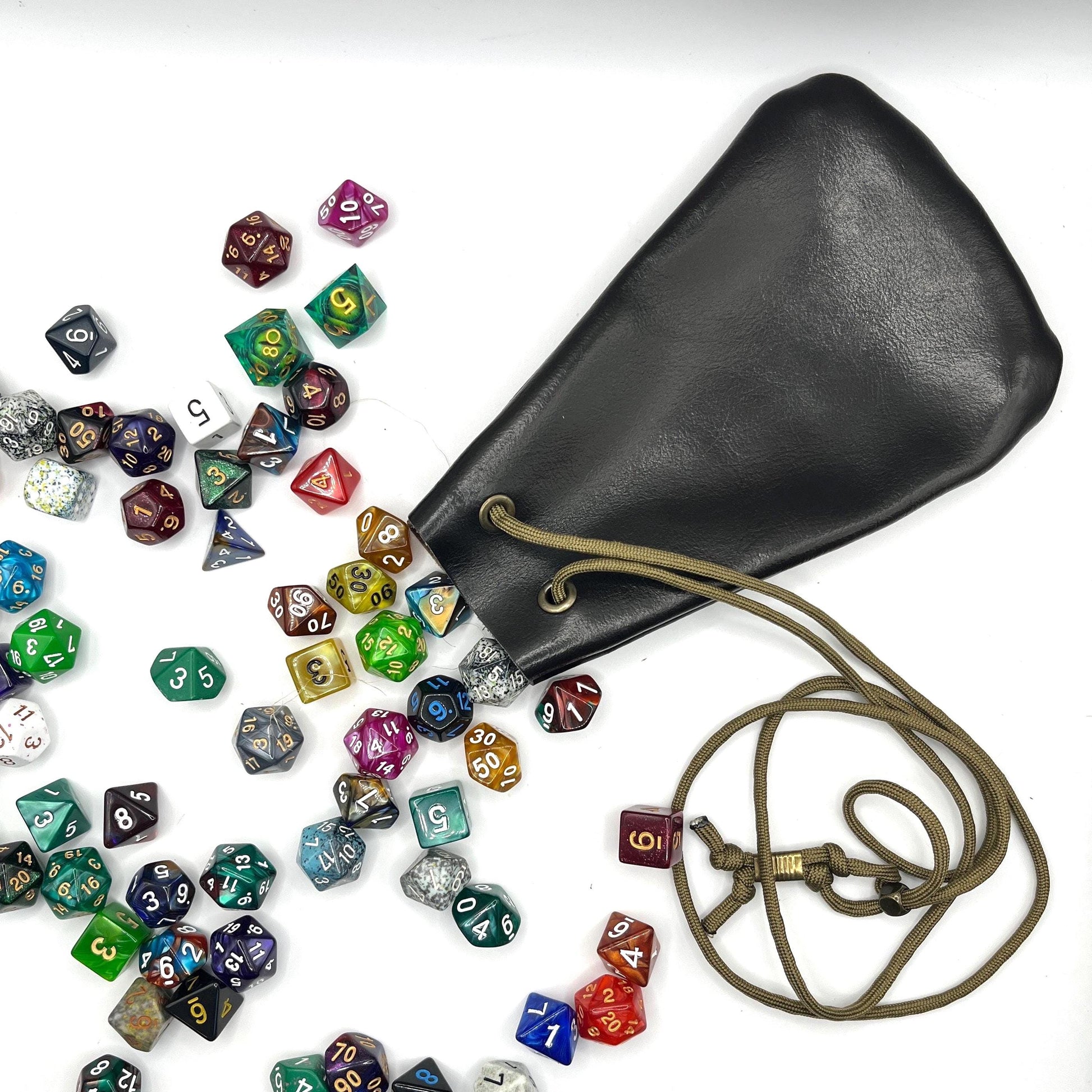 Handcrafted leather dice bag with drawstring, ideal for storing RPG dice sets. Perfect for DnD, tabletop games, or as a fantasy gift for gamers.