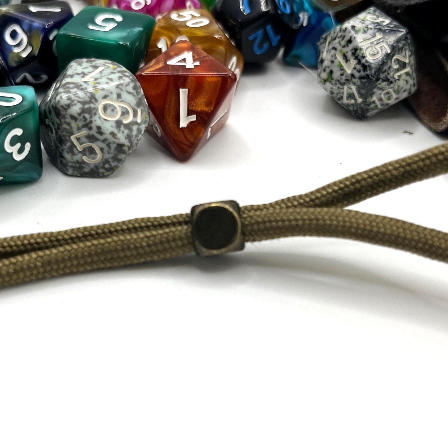 Handcrafted leather dice bag with drawstring, ideal for storing RPG dice sets. Perfect for DnD, tabletop games, or as a fantasy gift for gamers.