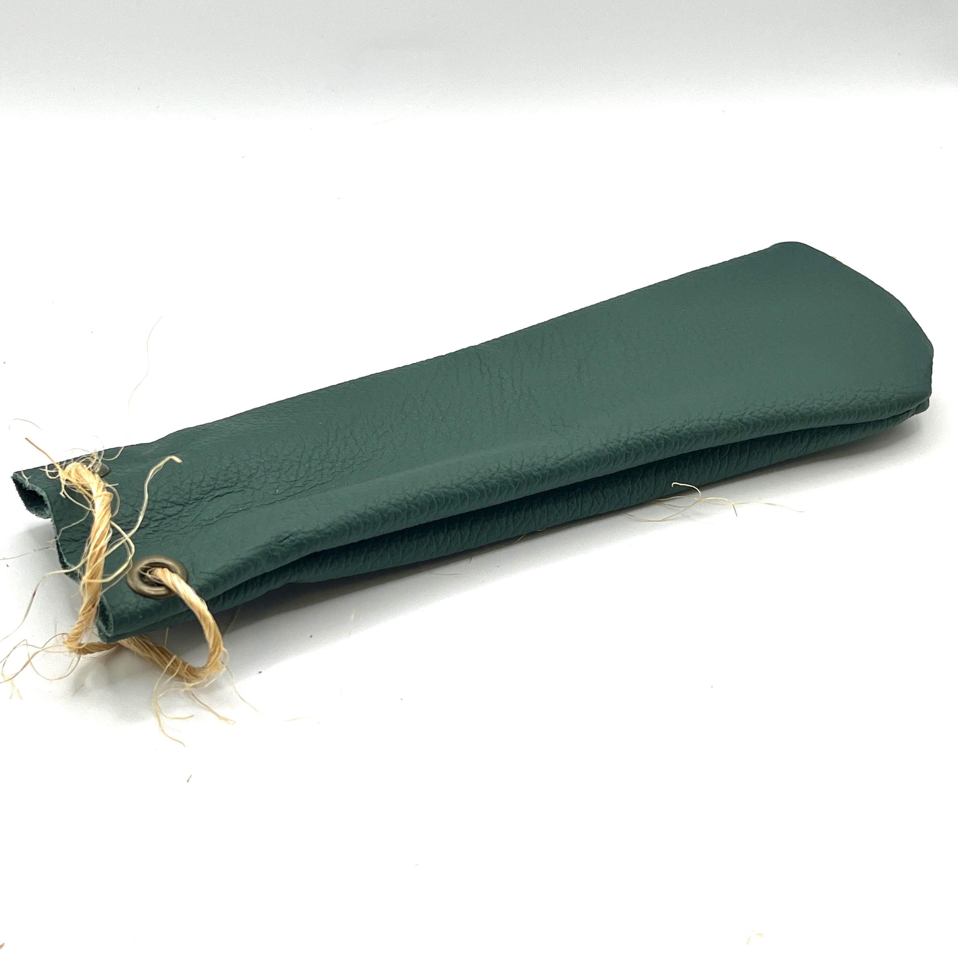 Handmade upcycled Italian leather pencil bag with drawstring, minimalist brown leather pen pouch for school, office, or travel, sustainable artisan stationery case.