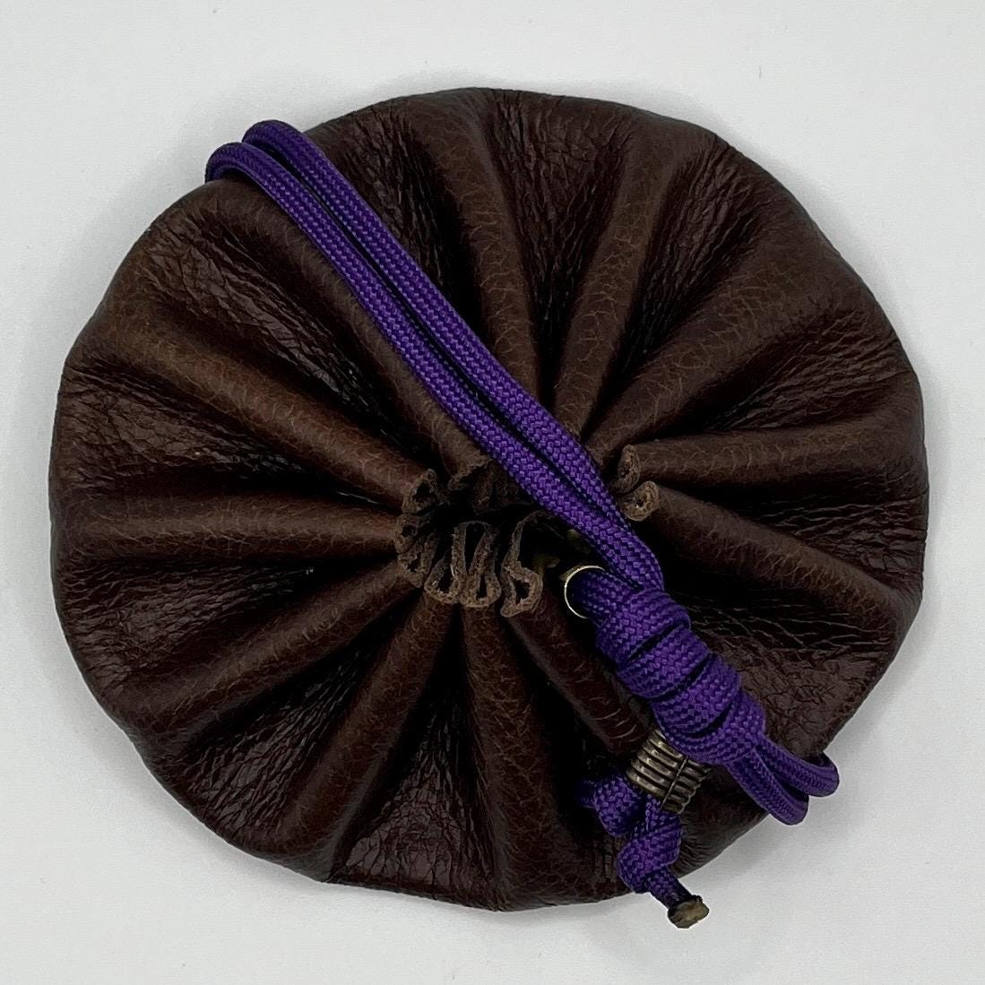 Handcrafted leather dice bag with drawstring, ideal for storing RPG dice sets. Perfect for DnD, tabletop games, or as a fantasy gift for gamers.