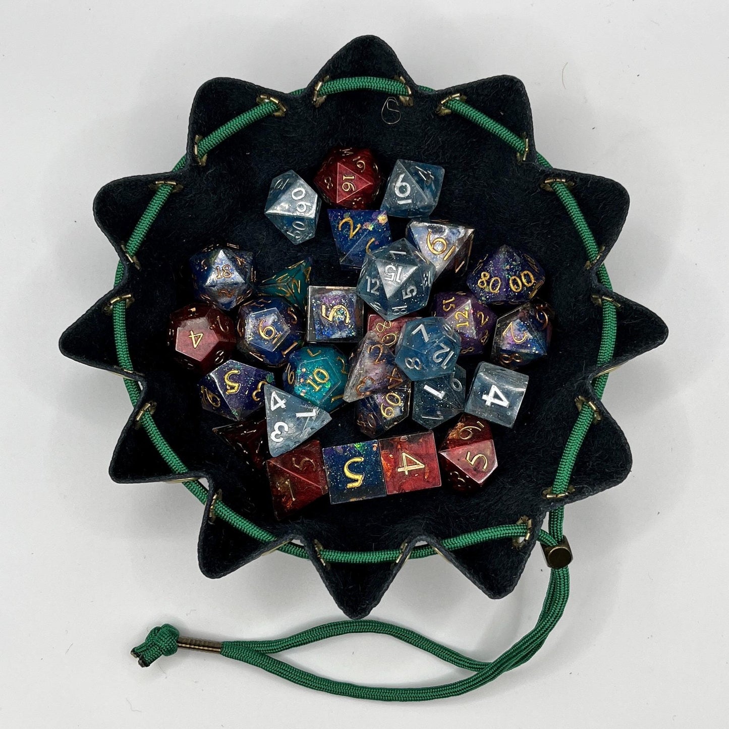 Handcrafted leather dice bag with drawstring, ideal for storing RPG dice sets. Perfect for DnD, tabletop games, or as a fantasy gift for gamers.