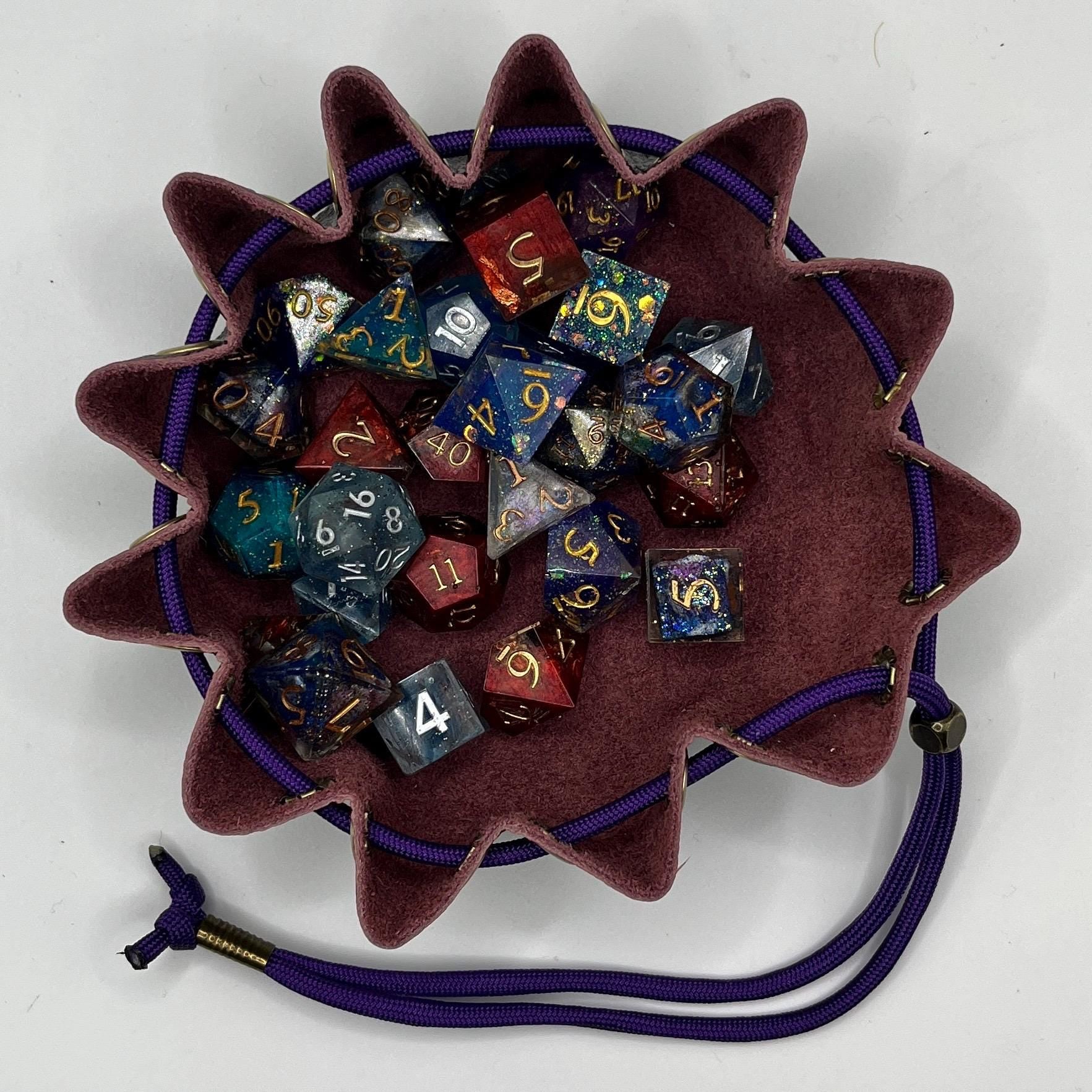 Handcrafted leather dice bag with drawstring, ideal for storing RPG dice sets. Perfect for DnD, tabletop games, or as a fantasy gift for gamers.