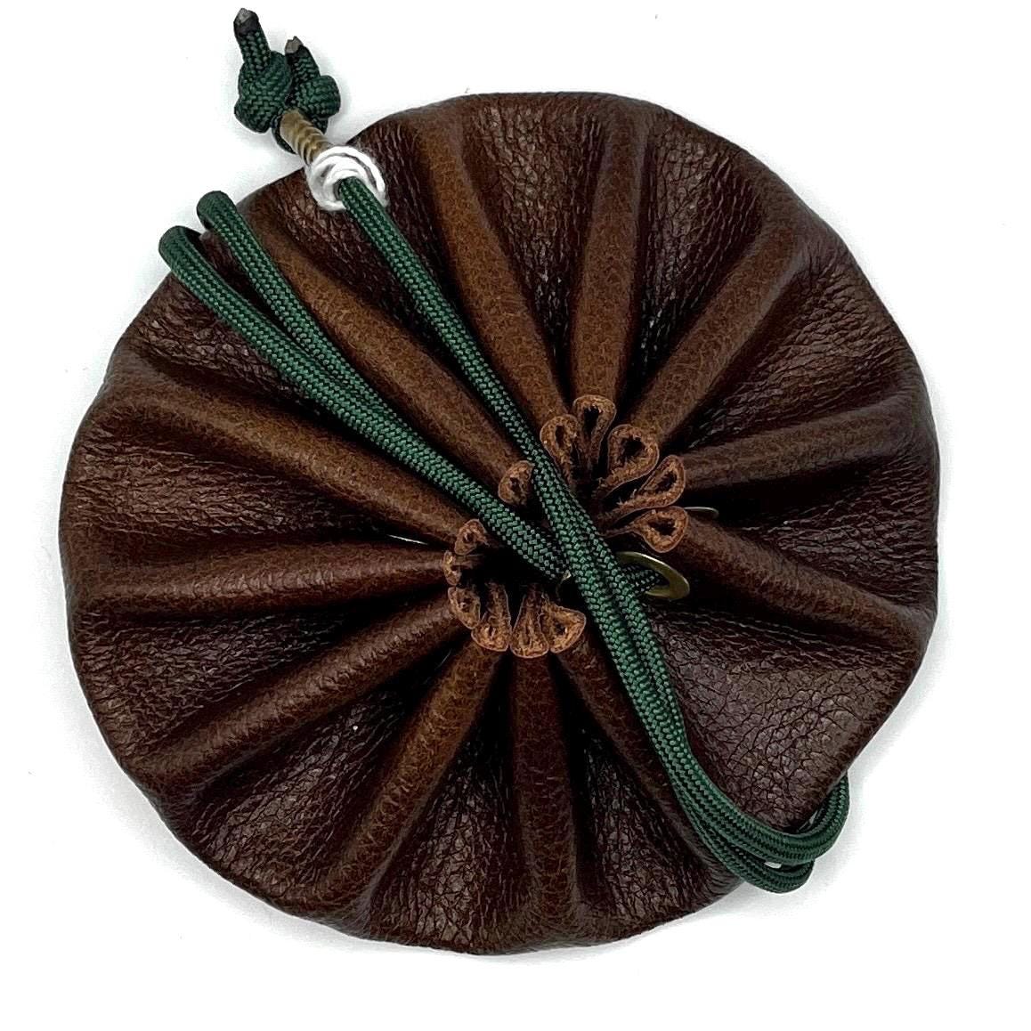 Handcrafted leather dice bag with drawstring, ideal for storing RPG dice sets. Perfect for DnD, tabletop games, or as a fantasy gift for gamers.