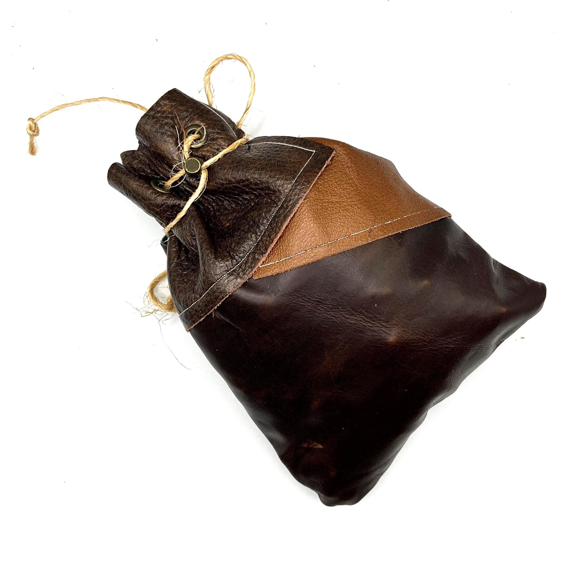 Handcrafted leather dice bag with drawstring, ideal for storing RPG dice sets. Perfect for DnD, tabletop games, or as a fantasy gift for gamers.