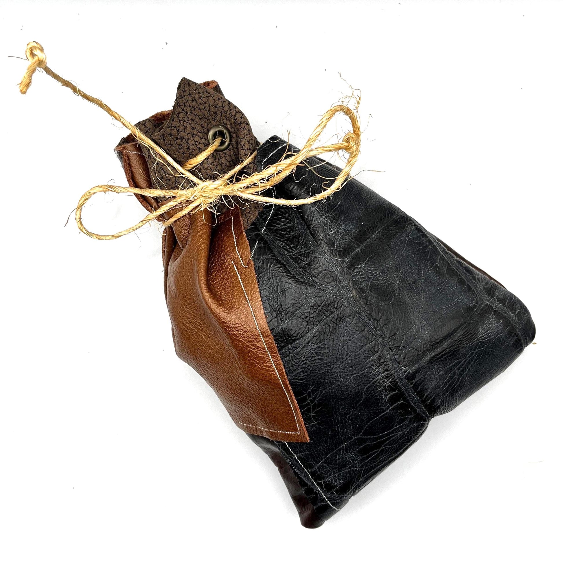 Handcrafted leather dice bag with drawstring, ideal for storing RPG dice sets. Perfect for DnD, tabletop games, or as a fantasy gift for gamers.