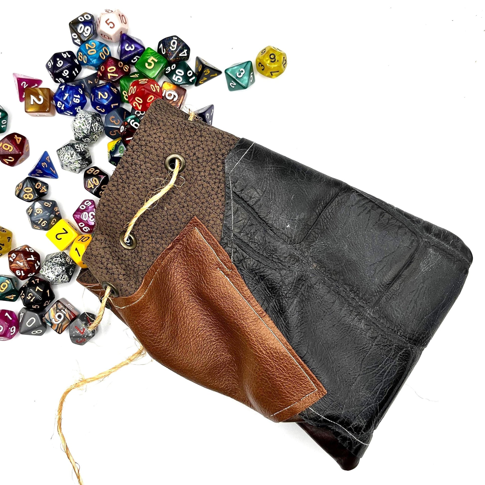 Handcrafted leather dice bag with drawstring, ideal for storing RPG dice sets. Perfect for DnD, tabletop games, or as a fantasy gift for gamers.