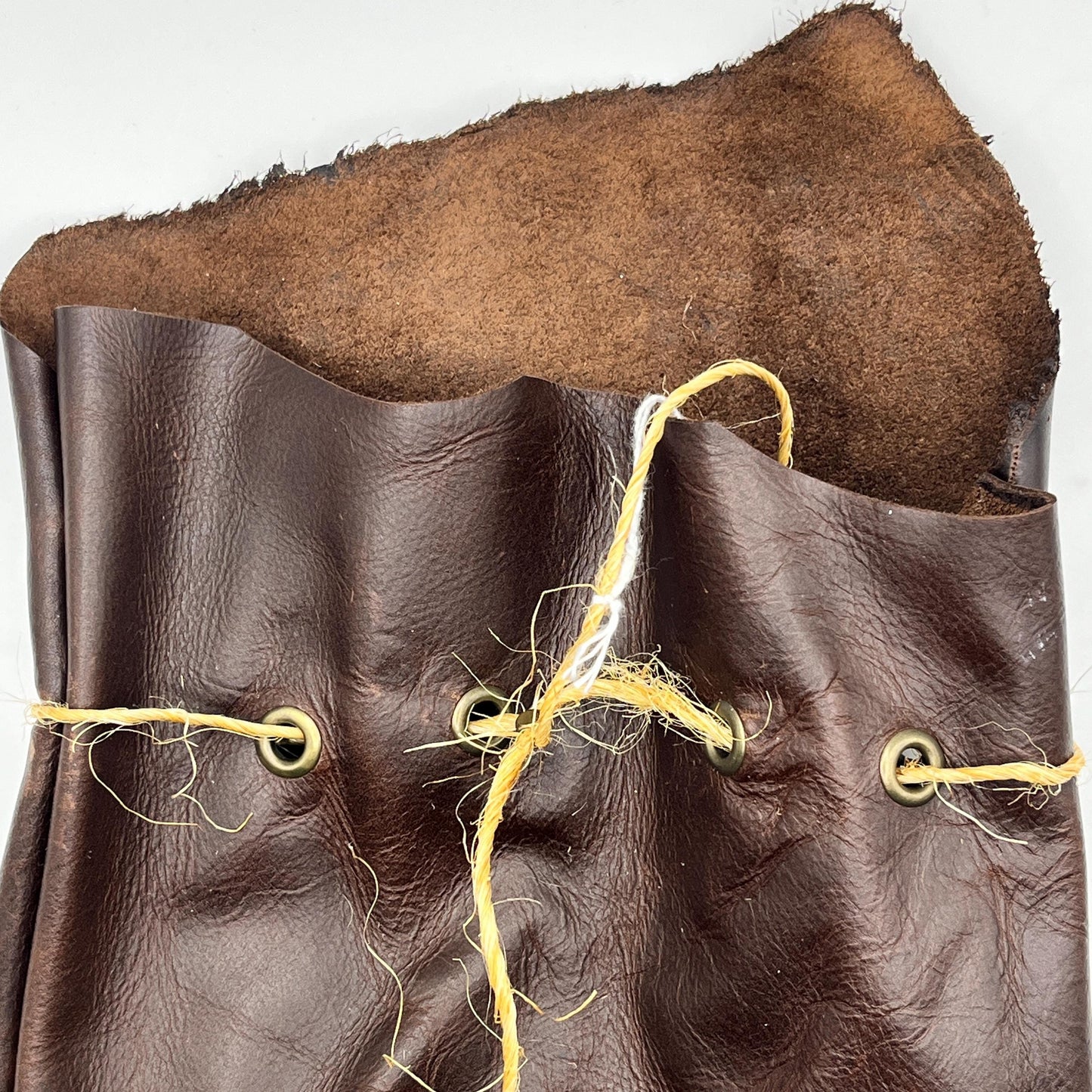 Handcrafted leather dice bag with drawstring, ideal for storing RPG dice sets. Perfect for DnD, tabletop games, or as a fantasy gift for gamers.