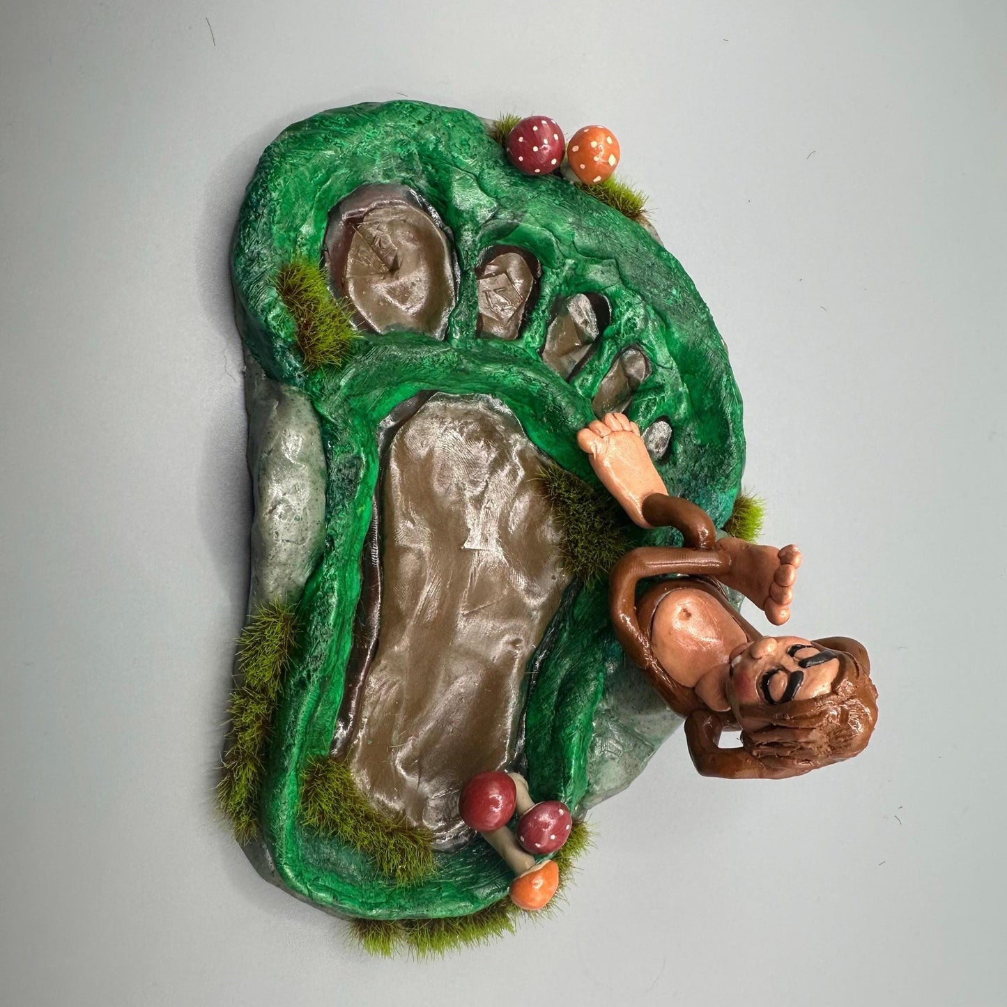 Cute handmade polymer clay dice tray and holder for a cryptid lover with a baby Bigfoot theme. Perfect gift for RPG, D&D, cryptid lovers and fantasy lovers.