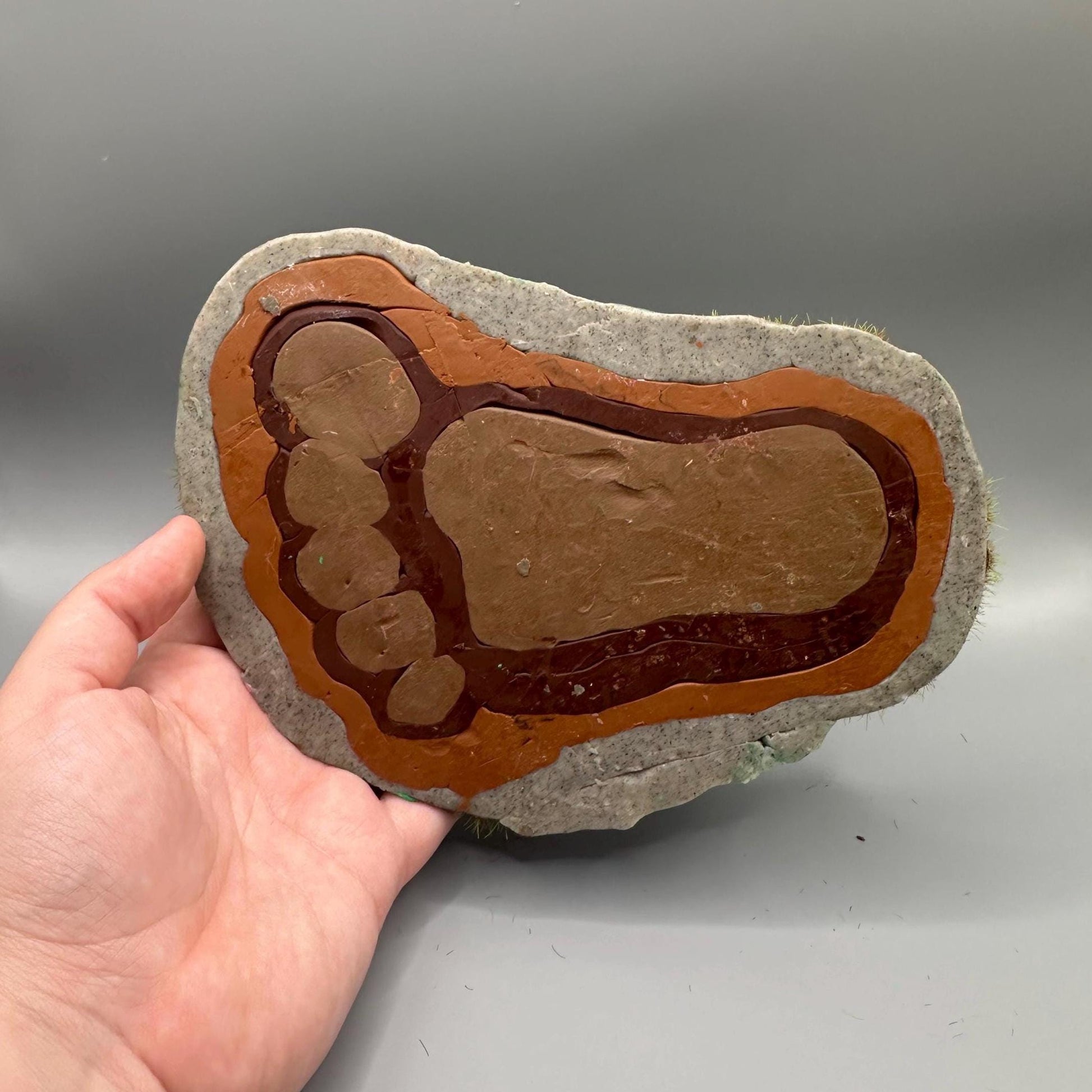 Cute handmade polymer clay dice tray and holder for a cryptid lover with a baby Bigfoot theme. Perfect gift for RPG, D&D, cryptid lovers and fantasy lovers.