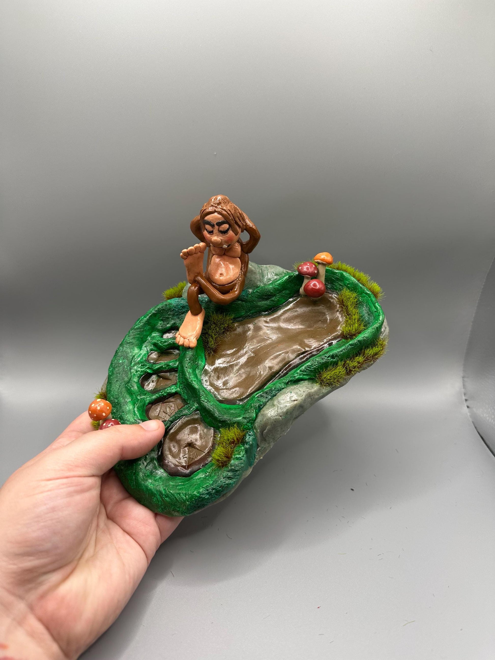 Cute handmade polymer clay dice tray and holder for a cryptid lover with a baby Bigfoot theme. Perfect gift for RPG, D&D, cryptid lovers and fantasy lovers.