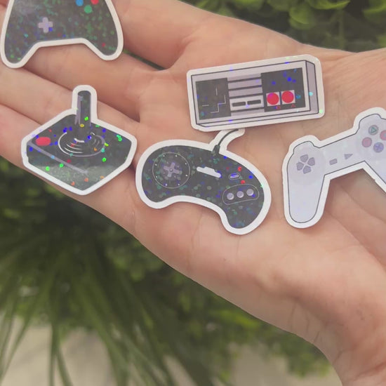 Set of holographic controller stickers for gamers. Shiny iridescent vinyl decals perfect for laptops, water bottles, consoles, and gaming accessories.