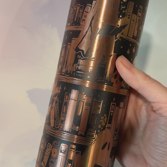 20oz laser engraved skinny tumbler featuring Halloween books, ghosts, bats, and spiderwebs. Perfect spooky drinkware for witchy book lovers and gothic décor fans.