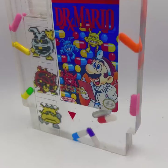Custom handmade Dr. Mario NES cartridge featuring iconic pixelated viruses and colorful pills. A perfect gift for retro gaming enthusiasts or unique home decor for lovers of nostalgic Nintendo games.
