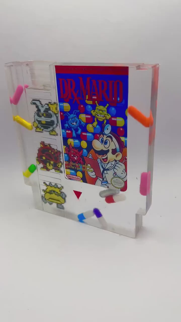 Custom handmade Dr. Mario NES cartridge featuring iconic pixelated viruses and colorful pills. A perfect gift for retro gaming enthusiasts or unique home decor for lovers of nostalgic Nintendo games.