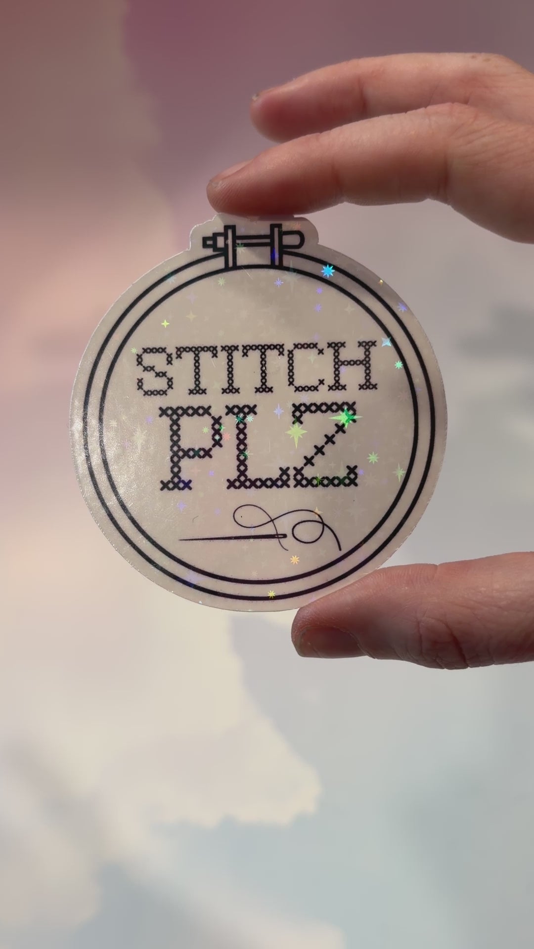 Black and white holographic vinyl sticker featuring a cross stitch hoop with the phrase "STITCH, PLZ," weather and water resistant.