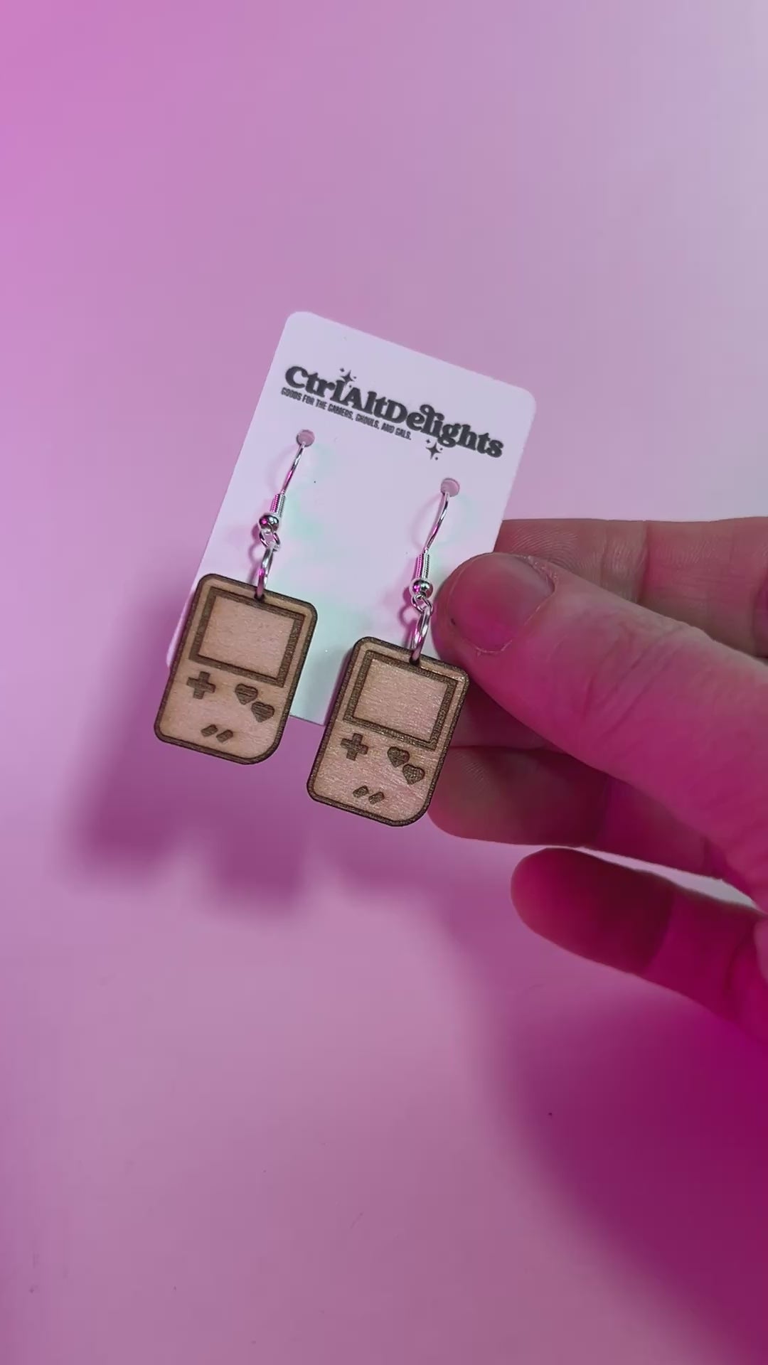Wooden laser engraved Gameboy earrings with heart-shaped buttons. Lightweight dangle earrings for gamers and retro game lovers. Geeky gift for gamer girls.