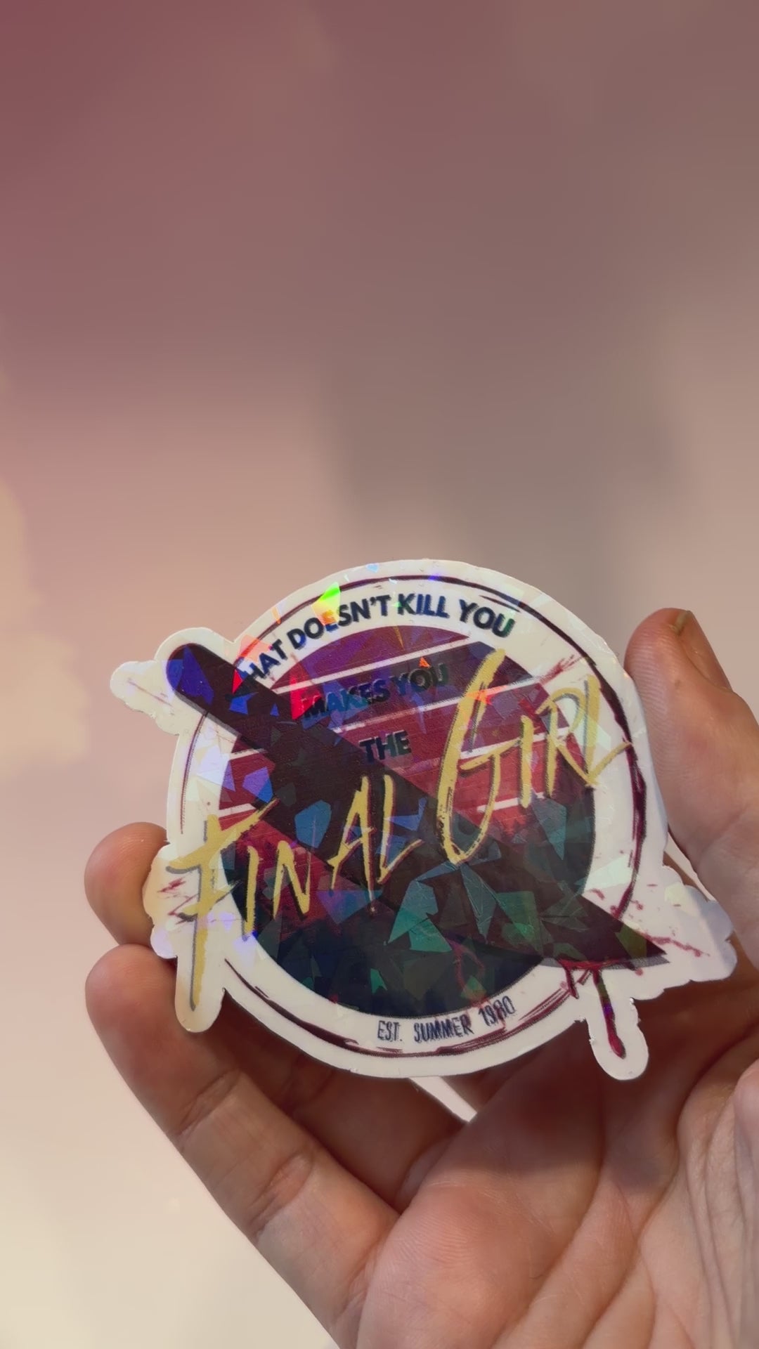 Sticker with text 'What doesn't kill you makes you the final girl' and a knife on a white background