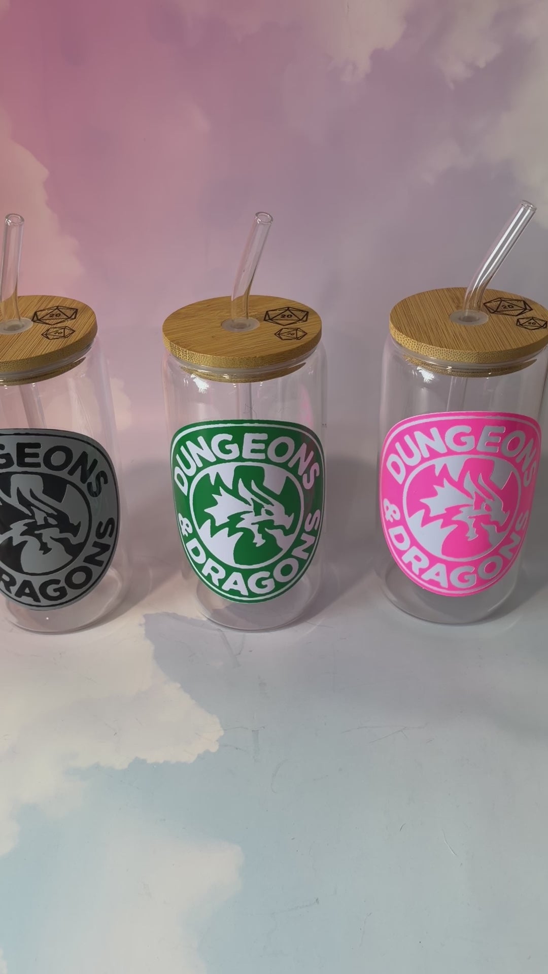16 oz Dungeons and Dragons glass coffee can with vinyl fantasy design, bamboo lid engraved with two D20 dice, and straw. Custom colors available. Handwash only; not dishwasher or microwave safe.