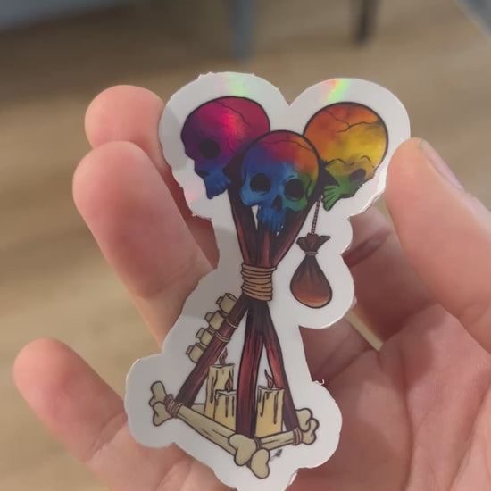 Holographic Dead by Daylight Totem Sticker featuring a skull totem design. Perfect for horror gamers and fans of DBD, this unique gaming decal adds a spooky flair to any collection. Durable and eye-catching, great for laptopsand accessories.