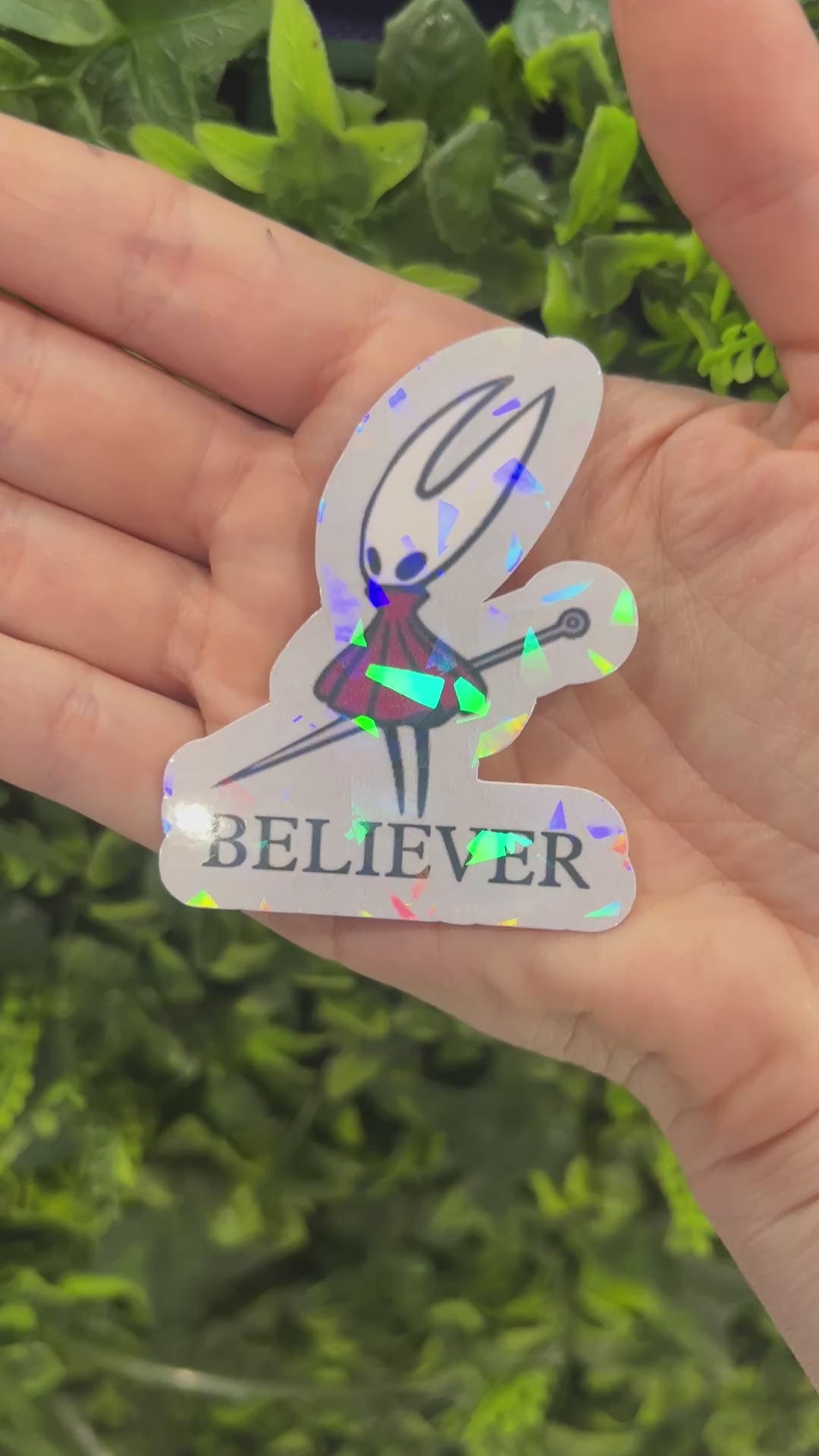 Holographic Hornet “BELIEVER” vinyl sticker inspired by Hollow Knight Silksong. Durable, shiny gamer decal perfect for laptops, water bottles, or journals.